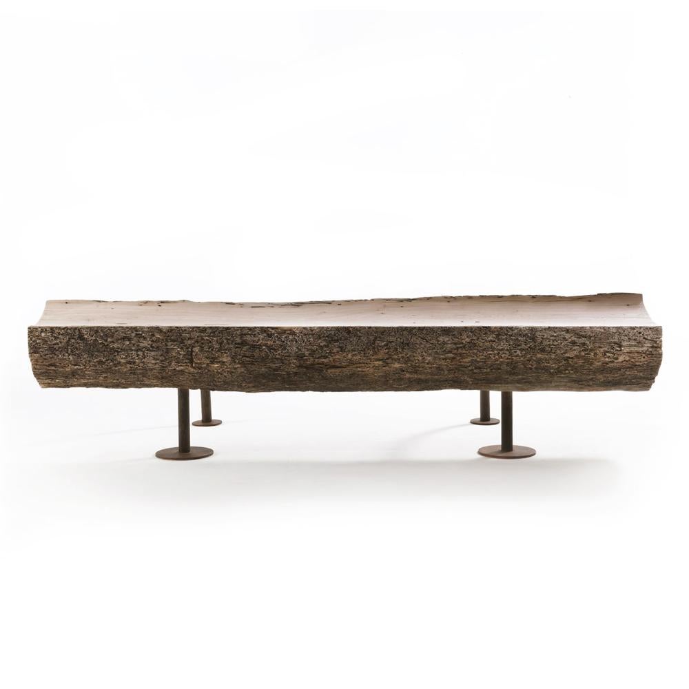 Bench raw oak made with raw oak trunk
with bark. Seating without bark and
with oxidized iron mat transparent lacquered
base structure. Measures: L 250 x D 96 x H 55/62.5cm.
 