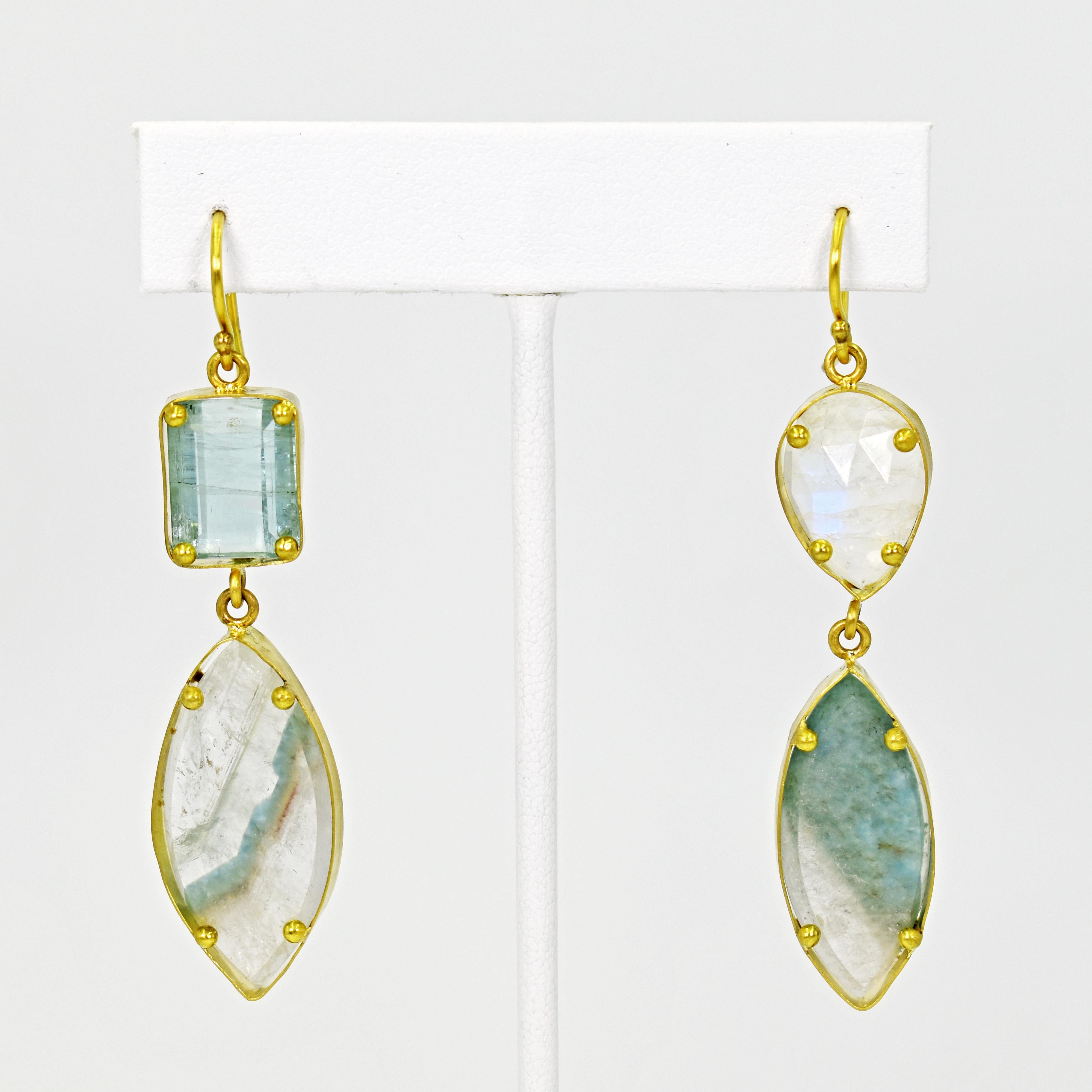 Handmade, one-of-a-kind 22k yellow gold two-tier asymmetrical dangle earrings featuring an emerald cut Aquamarine, rose cut pear shaped Moonstone, and two Paraiba Tourmaline in matrix slices. Earrings are 2.5 inches in total length. Beautiful sea