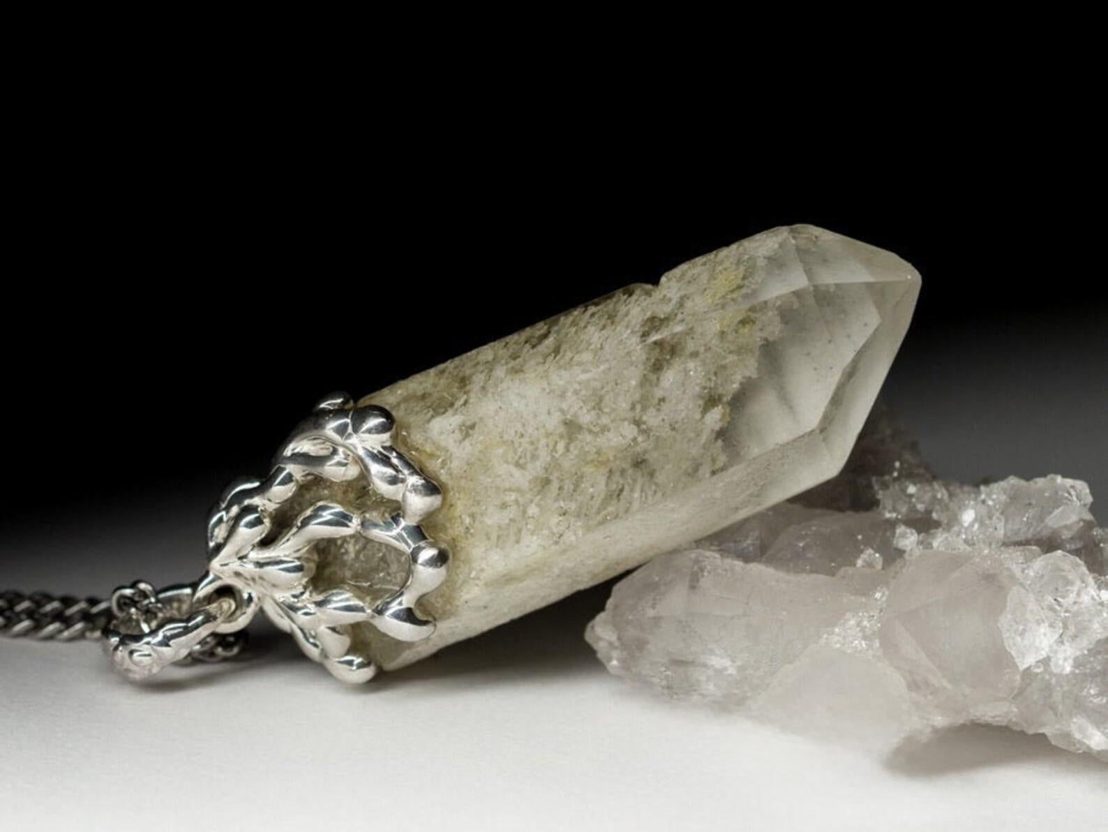 Medium large silver necklace with natural raw Rock Crystal crystal with inclusions
crystal origin - Ural mountains 
crystal weight  - 56.5 ct
gem size is 0.43 х 0.63 х 1.73 in / 11 х 16 х 44 mm
pendant weight - 15 grams
pendant leight - 2.05 in / 52