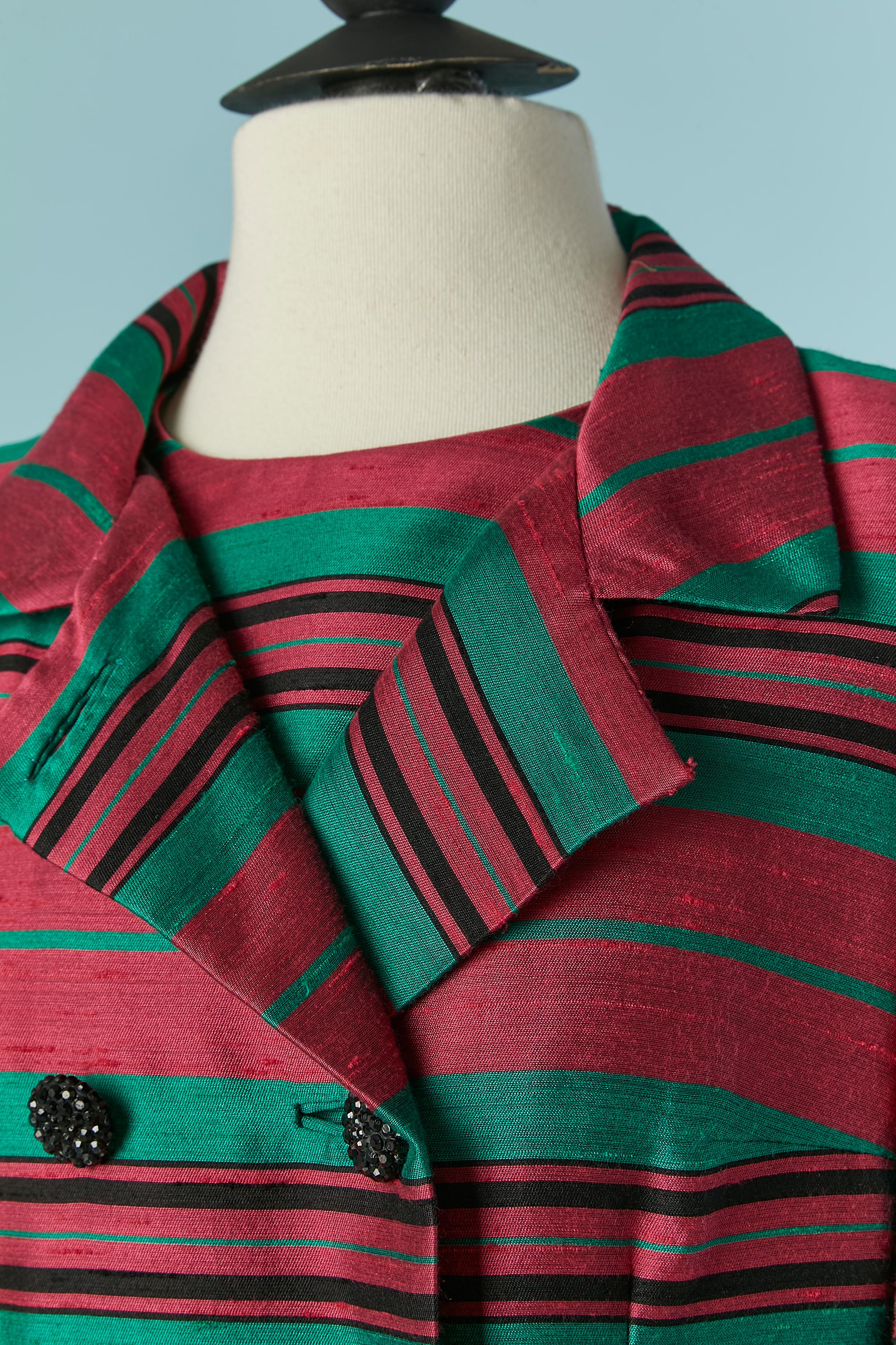 Raw silk dress and coat ensemble whit pink and green striped . Rayon lining. Button and buttonhole closure on the front of the double breasted coat and pocket on both side.  Zip closure on the middle back of the dress. 
SIZE 38 (Fr) M 
