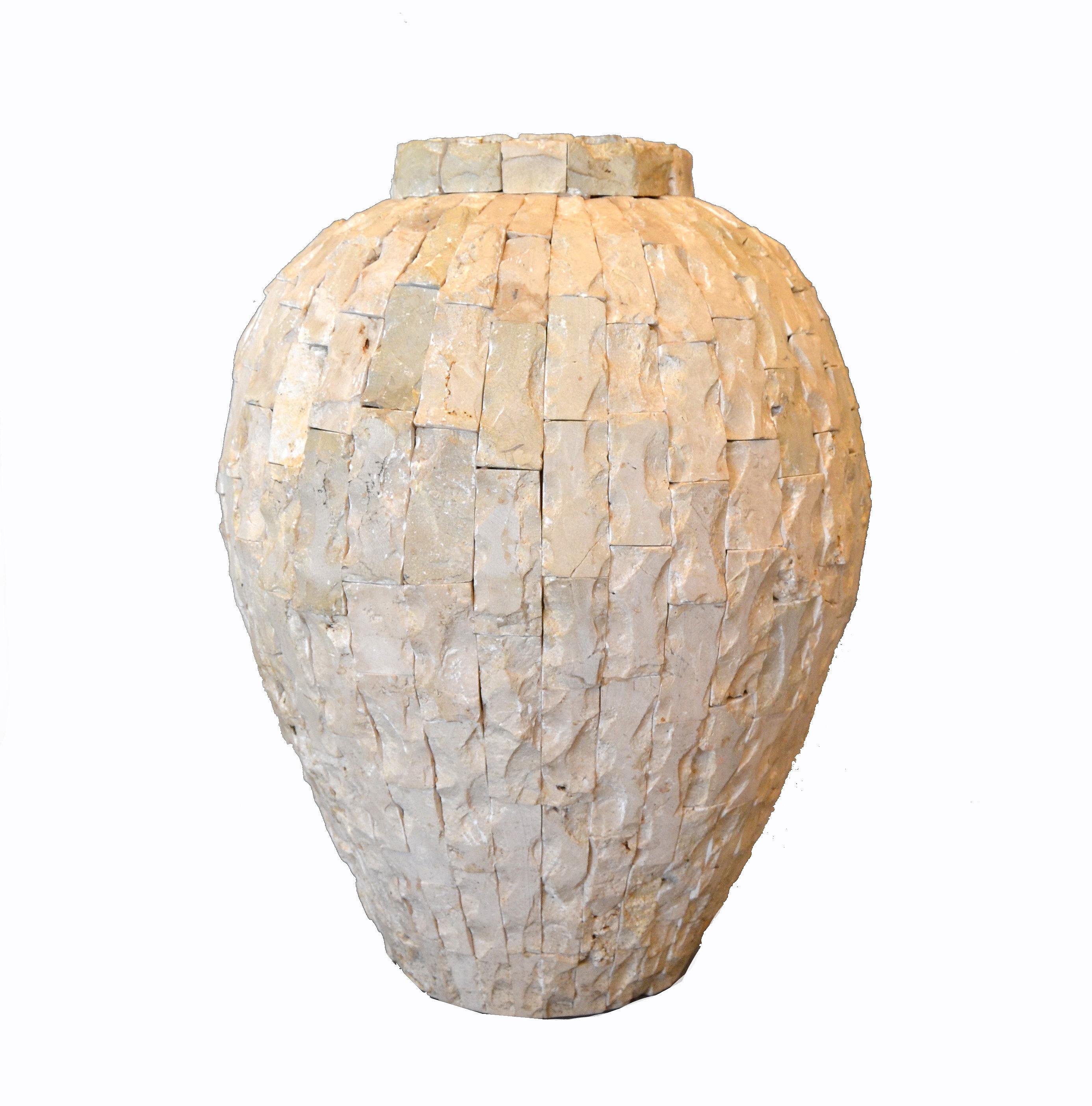 Heavy raw tessellated fossil stone over clay floor vase.
The stone pieces are not polished and have great patterns as well as sea shells.
Will look great in a sunroom.
   