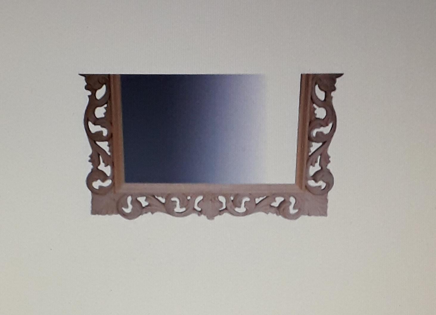 Italian carved mirror
Carved in lime wood in the traditional Florentine manor the Italians have been reviving these mirrors for centuries deriving them from gilded 17th century models.

The mirror seems smaller in the images and measures just