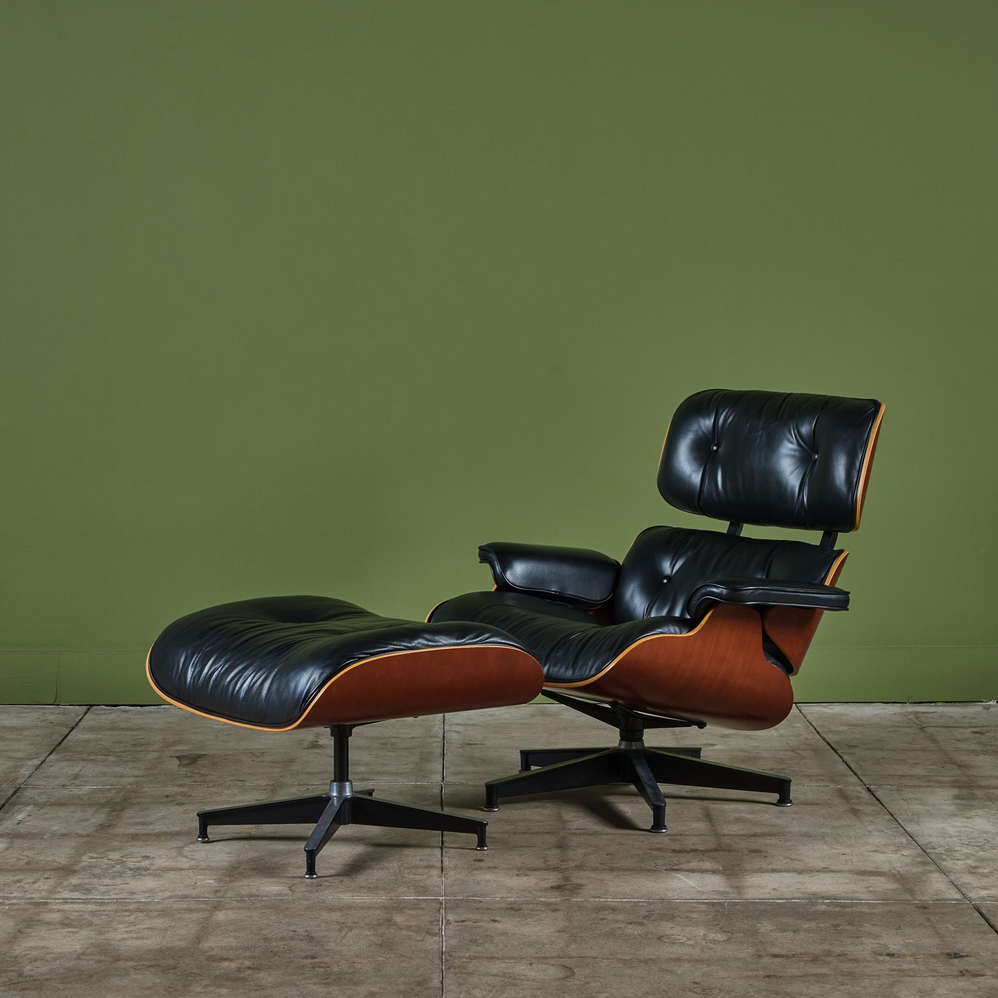 The iconic 670/671 lounge chair with ottoman by Ray and Charles Eames for Herman Miller, c.2002, USA. This version has foam cushions and rectangular black upholstery clips. The set is in vintage condition with the original black leather upholstery