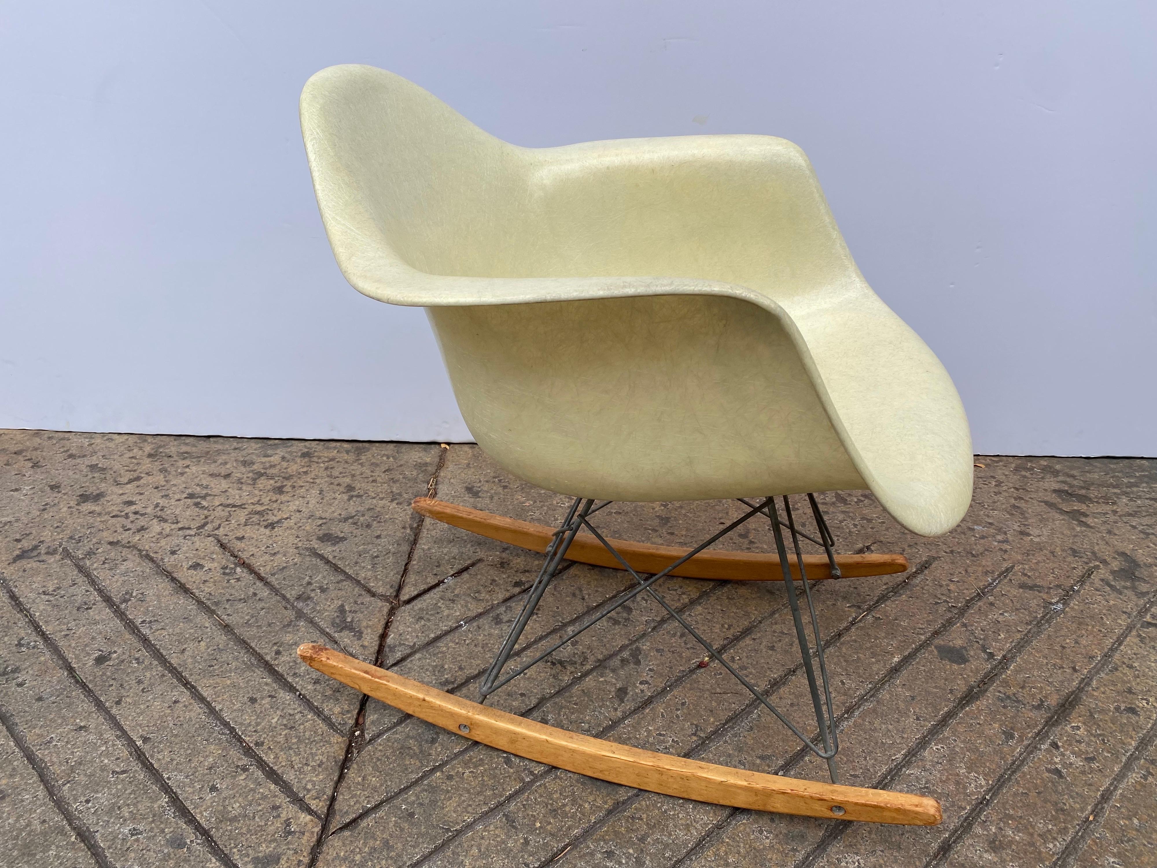 Ray and Charles Eames Rope Edge Zenith Armchair with an early Herman Miller Label. Iconic Classic in great shape! The shell looks amazing, showing a nice amount of fiber. Maple Runners show dog chewing at back ends, as seen in photos. Front tips are
