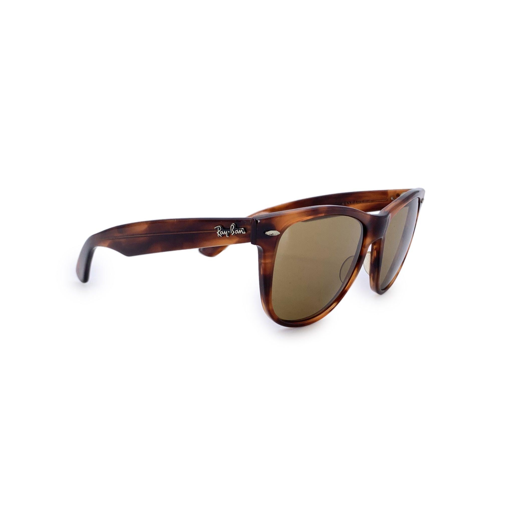 Step into a golden era of timeless cool with these Ray-Ban B&L Brown Acetate Wayfarer II Sunglasses. A true classic from the archives of American eyewear design, this 53/14 150 mm frame captures the essence of mid-century sophistication-where bold