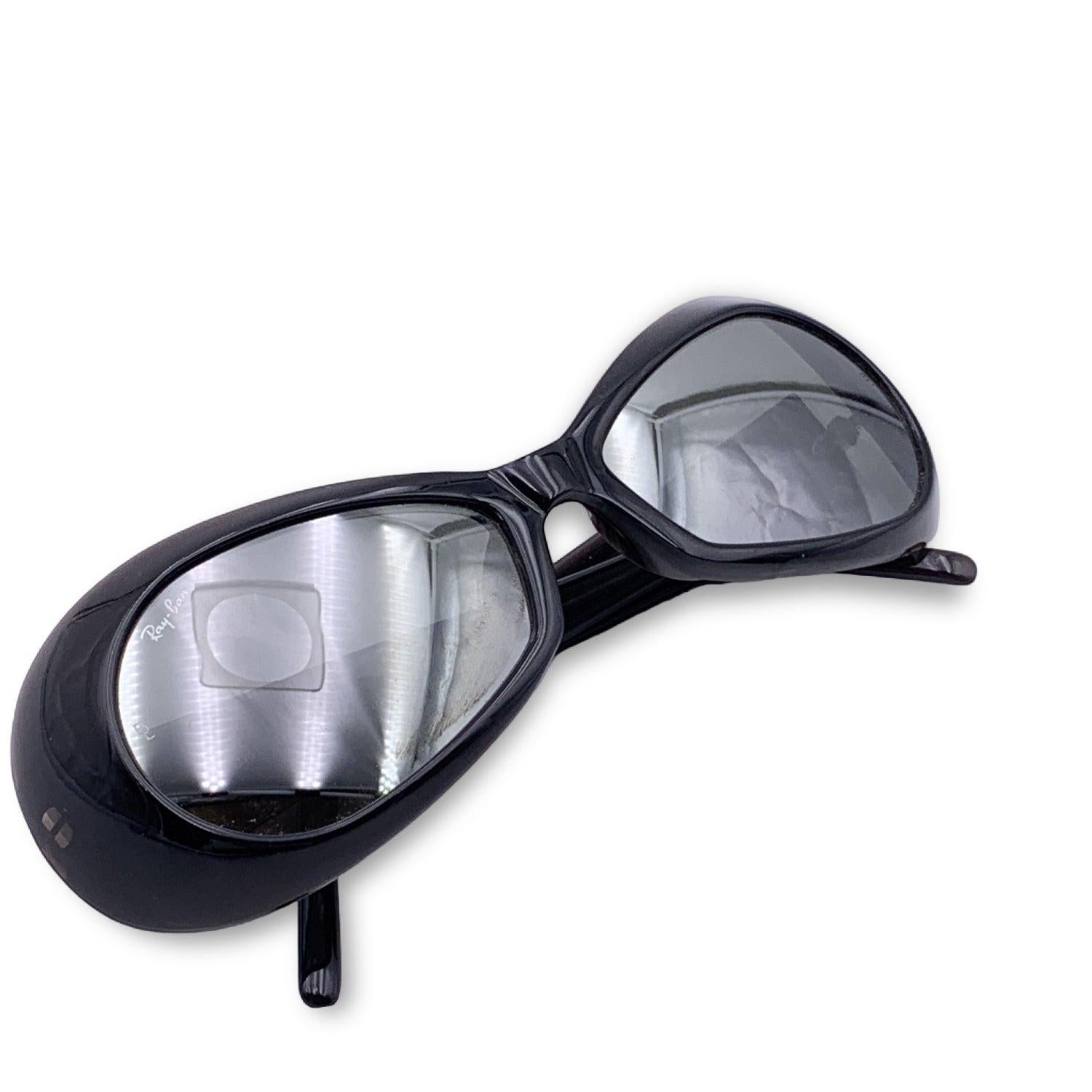 Vintage sunglasses by Ray-Ban Bausch & Lomb, mod. W2635 from the 90s. Black acetate frame. Butterfly design. Mirrored lenses, with BL etched on both corners. Made in USA Details MATERIAL: Acetate COLOR: Black MODEL: W2635 GENDER: Unisex Adults