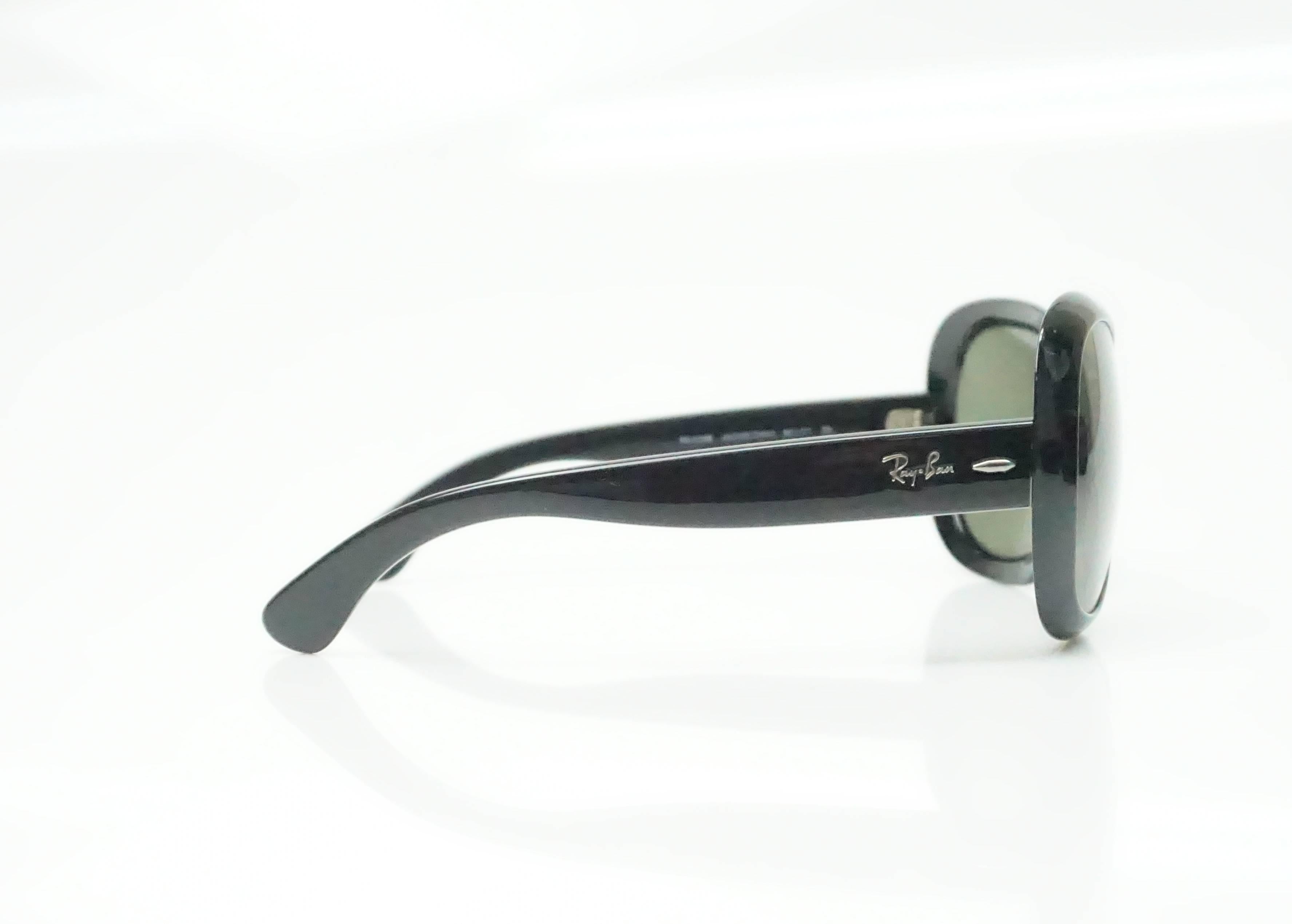 Ray-Ban Black Jackie Ohh II Sunglasses   These sunglasses are in excellent condition. They are all black with silver logo on the legs. The lens are dark and rounded.
Measurements
Front: 6