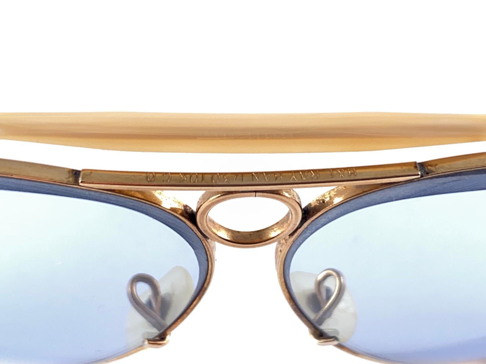 Vintage Ray Ban Aviator Gold 62mm with light Blue lenses. B&L etched  in both lenses. 

Comes with its original Ray Ban B&L case. 

Please notice this pair have minor sign of wear on the frame and lenses due to nearly 40 years of storage, hardly
