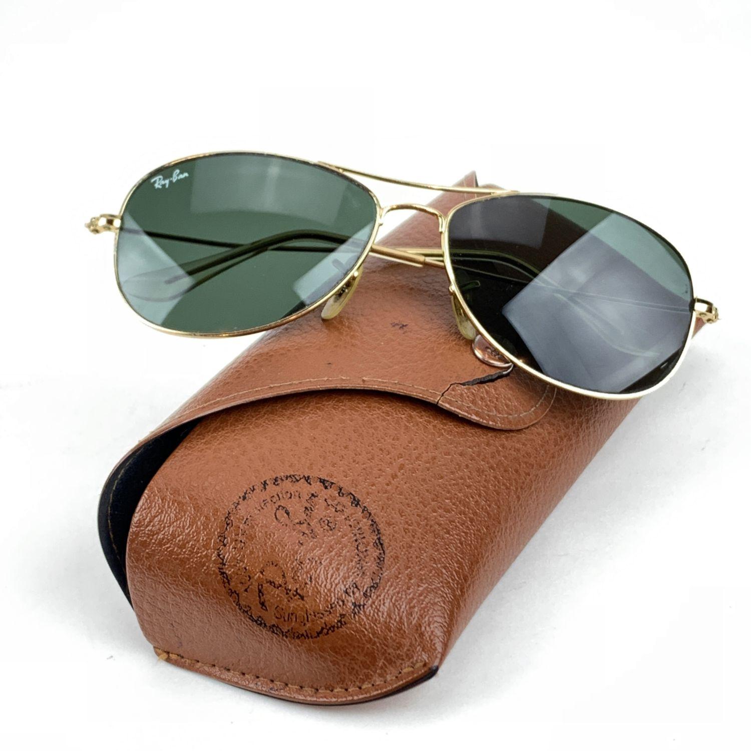 Vintage Ray Ban RB 3362 'Cockpit' sunglasses. Cool variation of traditional aviator glasses . Gold metal frame with original G15 green lenses RB etched on lens. RAY BAN gold logo printed on RIGHT lens. Style & refs: RB 3362 - Cockpit - 56/18 -