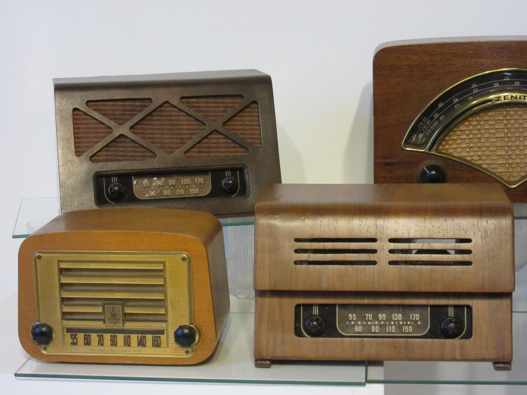 A collection of seven molded plywood radios designed by Ray and Charles Eames consisting of two Zenith, two Emerson, two Teletone and one Hoffman radio. All in very good condition most are in original condition. The radios date from the mid to late