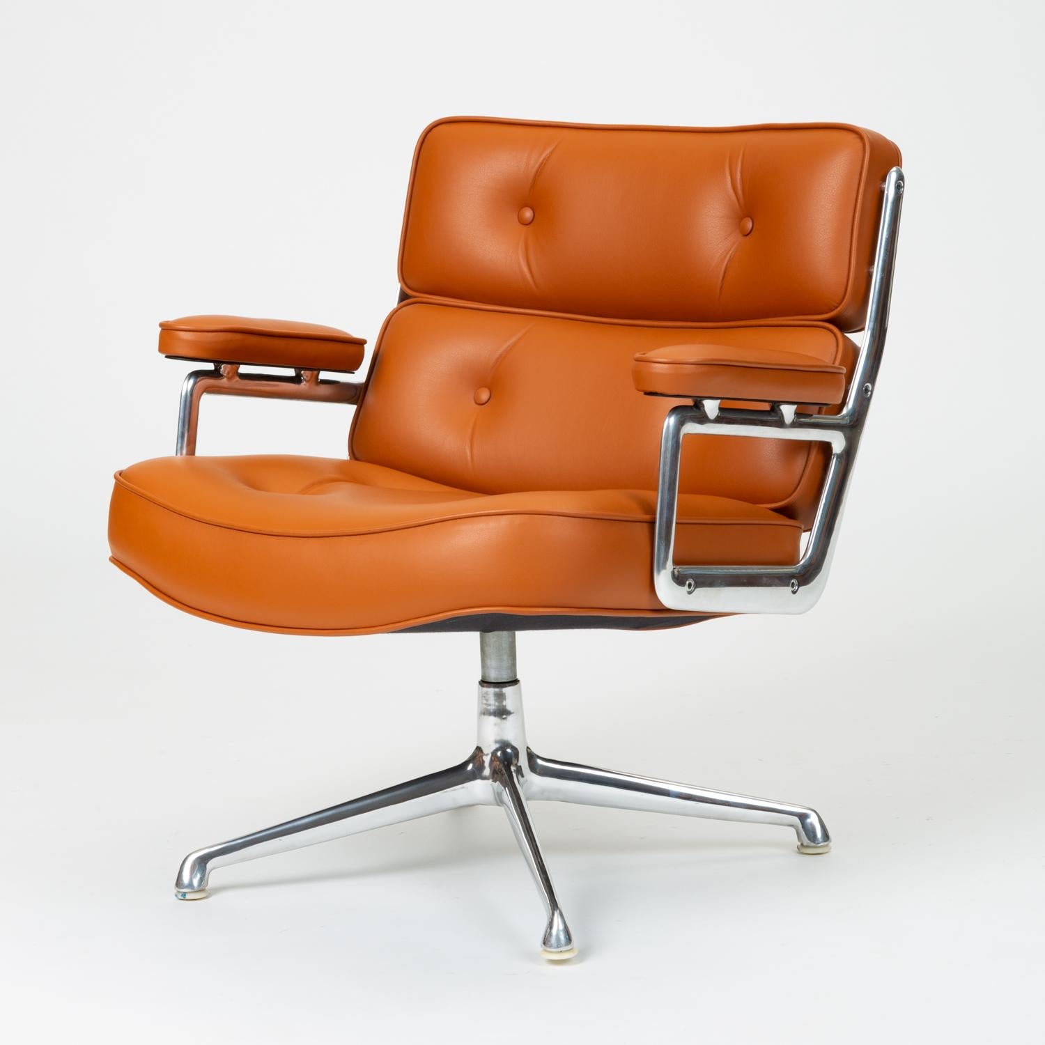 A legendary office design by Ray and Charles Eames for the three modernist lobbies of the new Time Life Building in Manhattan, the Time Life Lobby chair has a polished aluminum frame and segmented, tufted cushions in leather upholstery. Leather