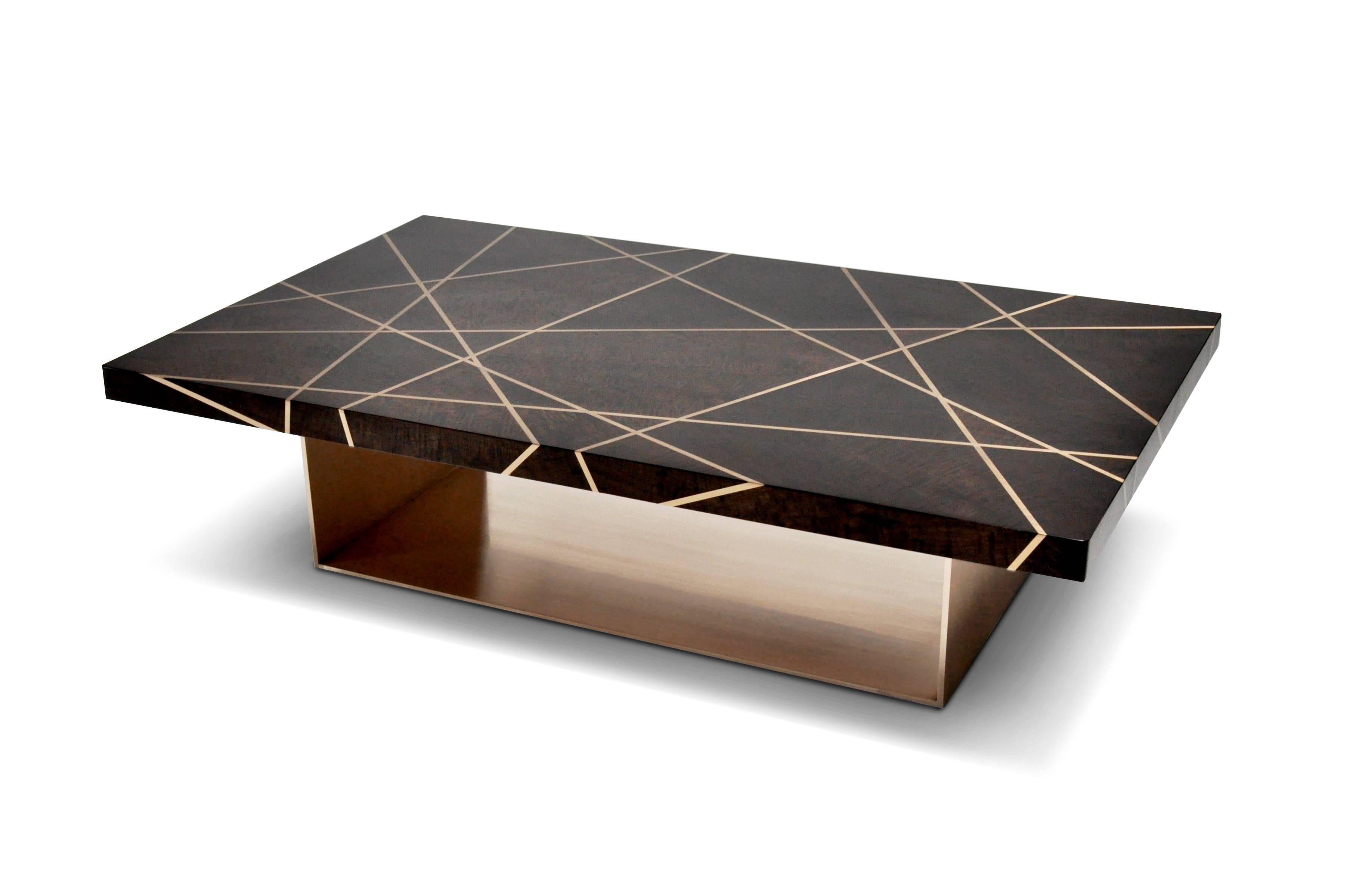 This Ray rectangular cocktail table is designed using custom dyed figured walnut with bronze inlay in a ray pattern and bronze base. The figured walnut top is a custom finish in a flat polished sheen with a custom radius edge detail. Bronze inlay