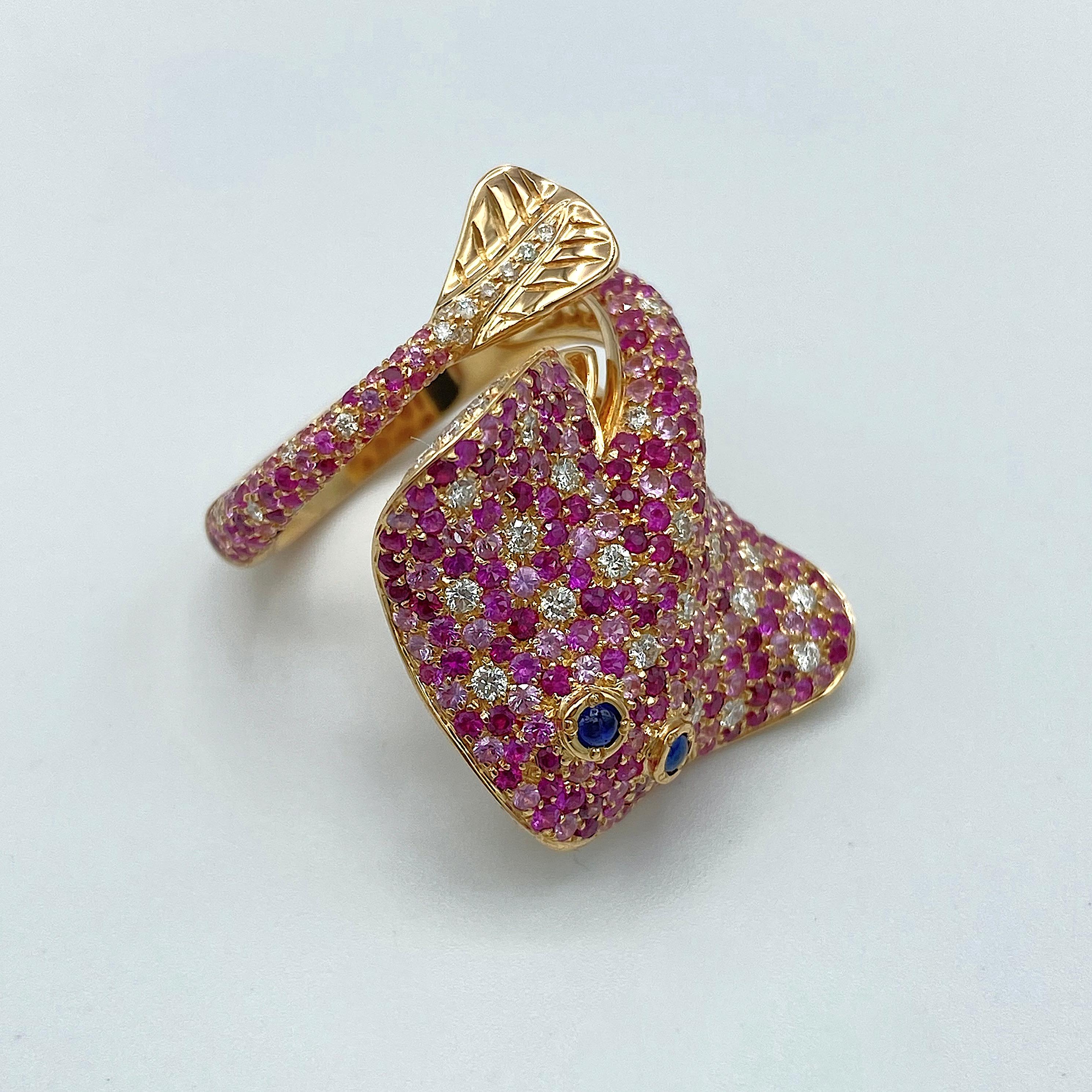 Ray Fish White Diamond Pink and Blue Sapphire Ruby 18 Kt Gold Ring Made in Italy
This ring is inspired by the sea and nature, it's a ray fish in red gold covered by many precious stones such as white diamonds, pink sapphires (in three kinds of