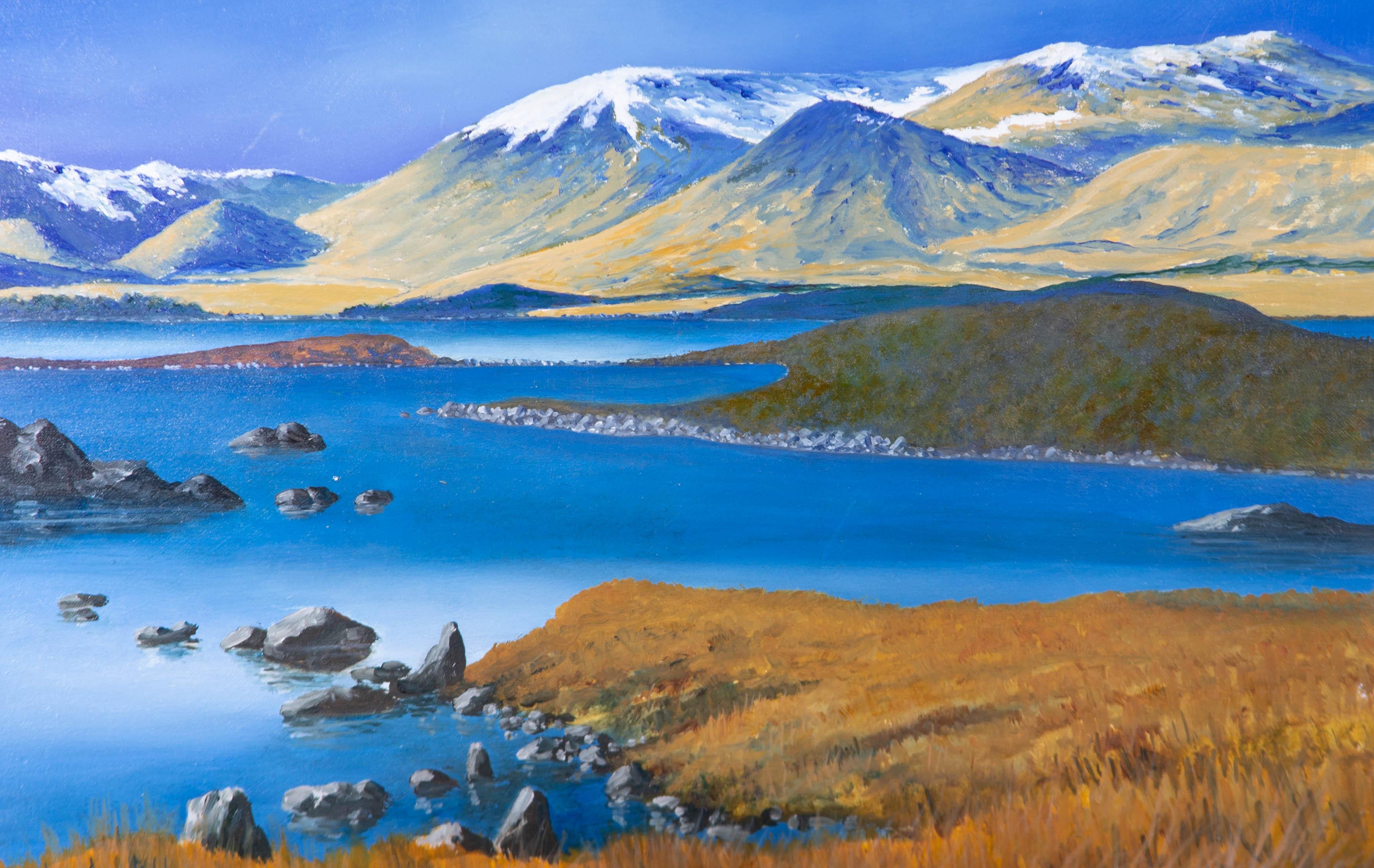 A vibrant oil painting by Ray Greenfield, depicting a landscape scene with a lake and snow capped mountains in the distance. Signed to the lower left-hand corner. On wood panel.
