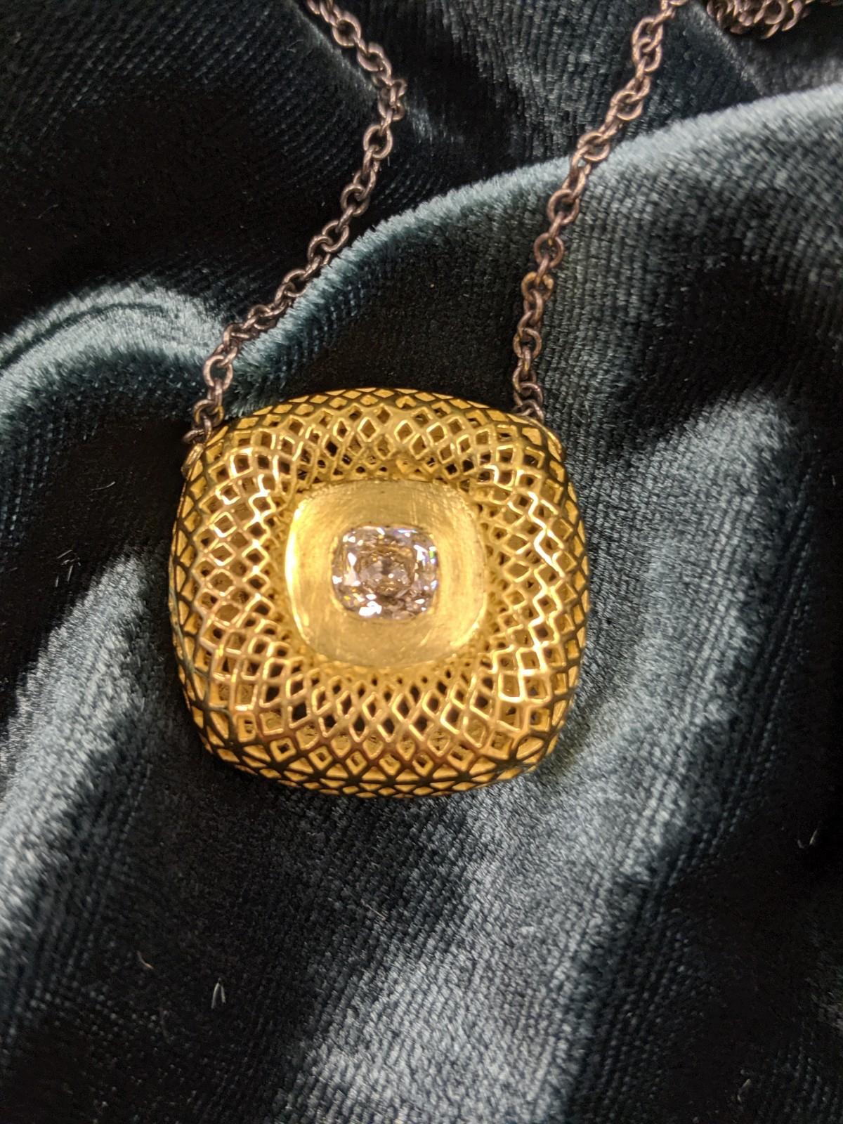 RAY GRIFFITHS pendant featuring a 1 carat antique cut cushion in 18 karat gold with oxidized silver chain and featuring Ray Griffiths signature 