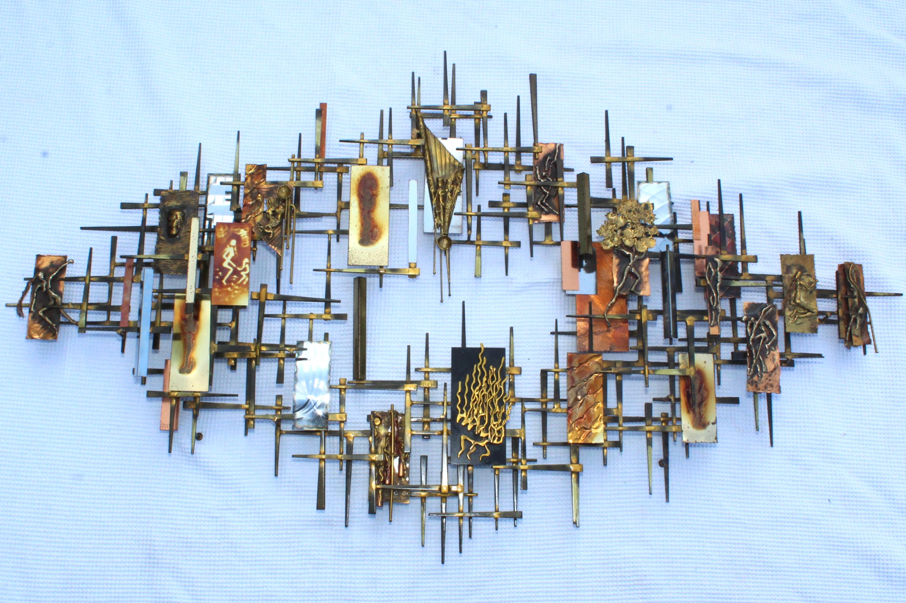Stunning 1980s mix metals Brutalist wall sculpture by Ray H. bergere. This multi layer sculpture is made of steel, brass, chrome and bronze.