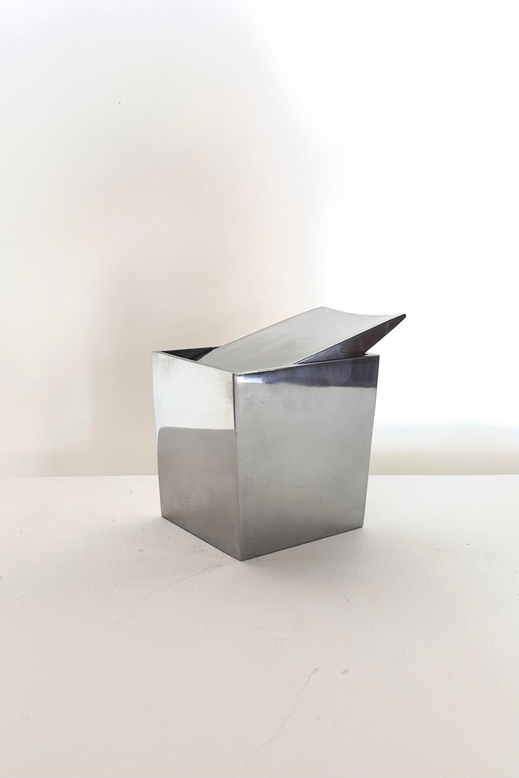 
French modern aluminum table ashtray Ray Hollis by Philippe Starck, 1986
Fantastic and iconic table ashtray mod. Ray Hollis with rectangular aluminum base. The structure tends to shrink towards the bottom. 
The ashtray was designed in 1986. The