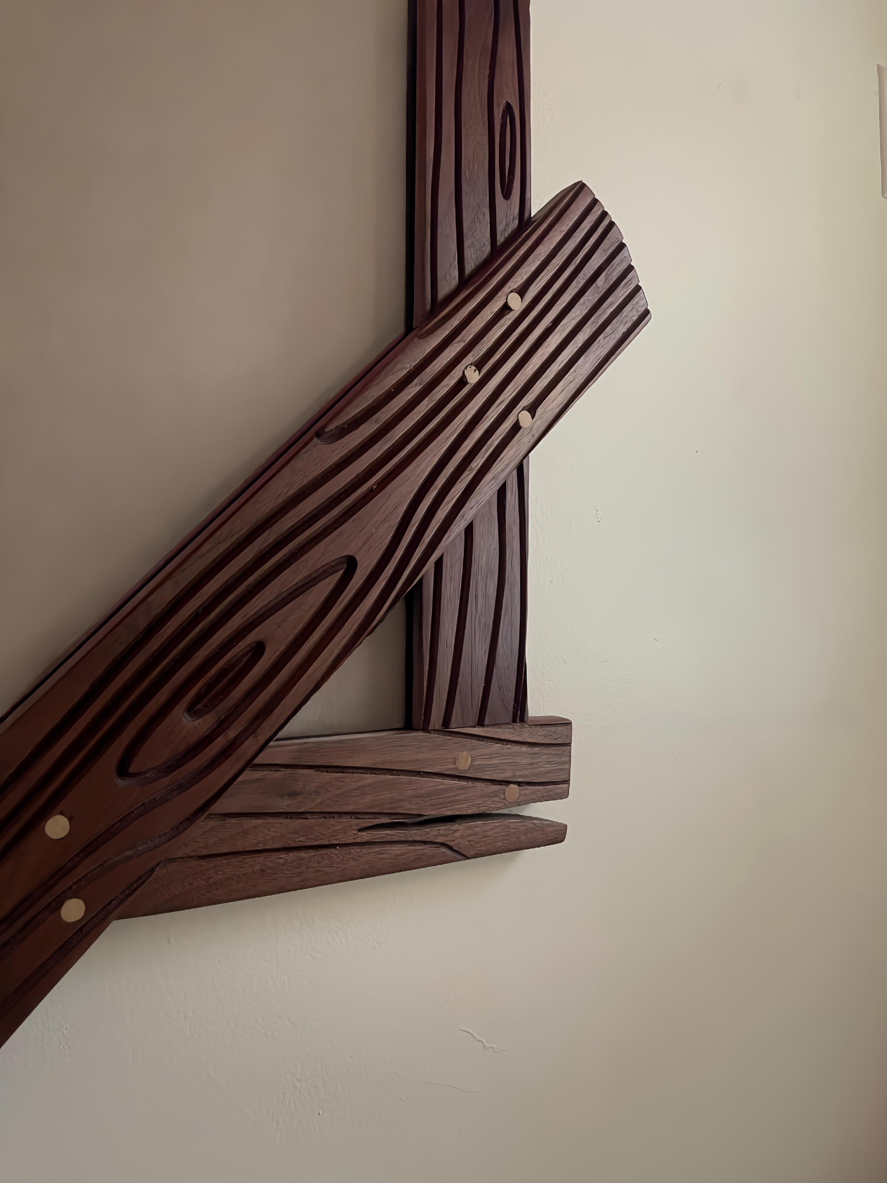 The Ray mirror comes in all walnut construction with ash and birch pins. each one is completely unique, with wood grain carvings on the face inspired by pallet wood from the tractor supply store.