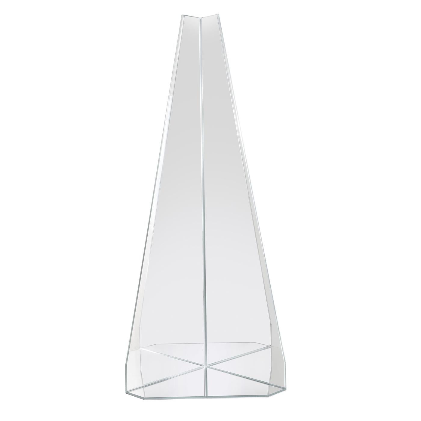 Designed by Marco Brunori, this wall mirror is a superb accent in a modern or eclectic interior. Thanks to the extra clear finish of its surface, the prism-shaped silhouette will reflect the surrounding light evoking the brilliance of a ray of sun,