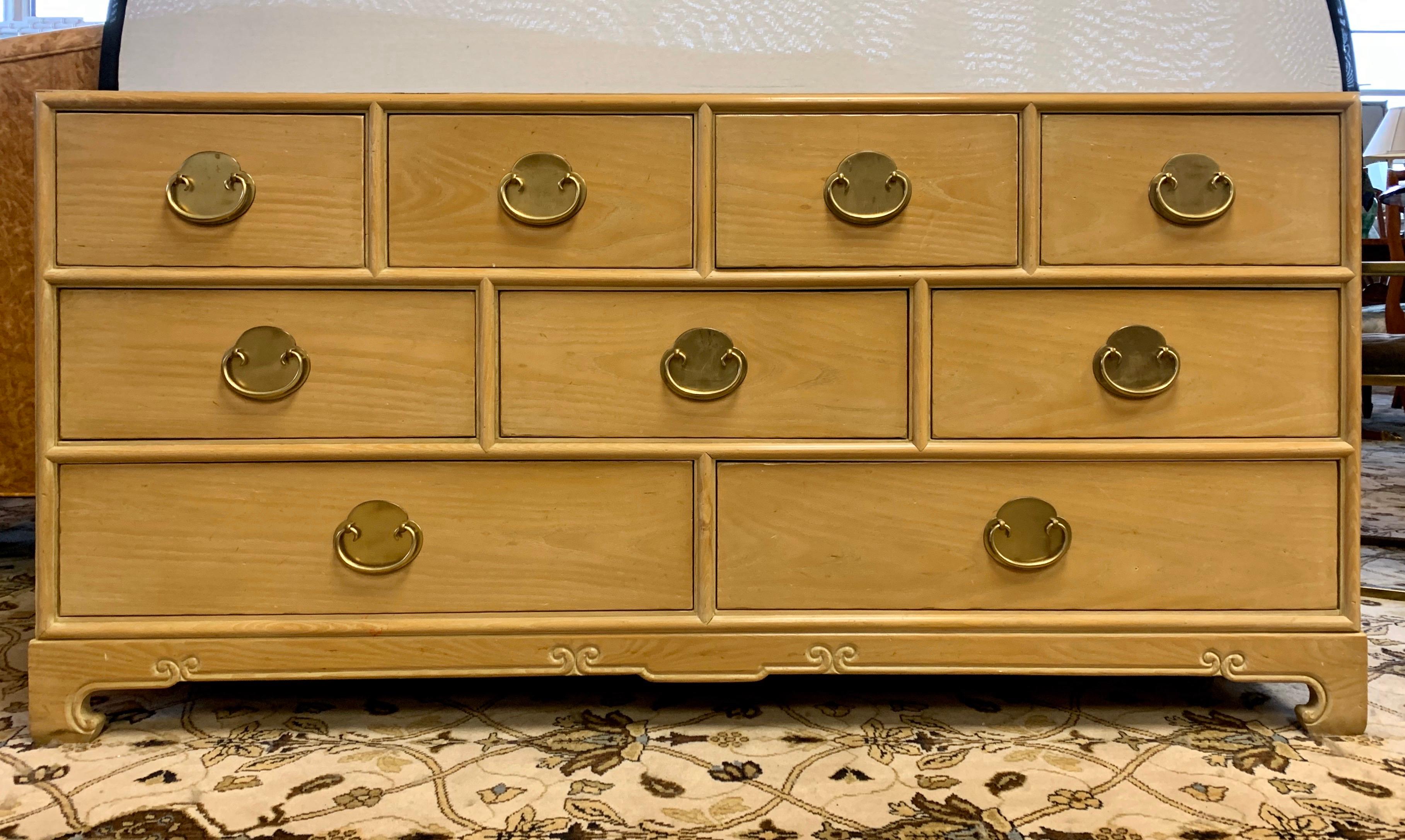 A gorgeous chest of drawers by Ray Sabota for Century Furniture Company, circa 1970s. Brass hardware and lovely motifs accent the pieces. Excellent vintage condition. Retains the maker mark and Sabota label as well. Features nine drawers. Also note