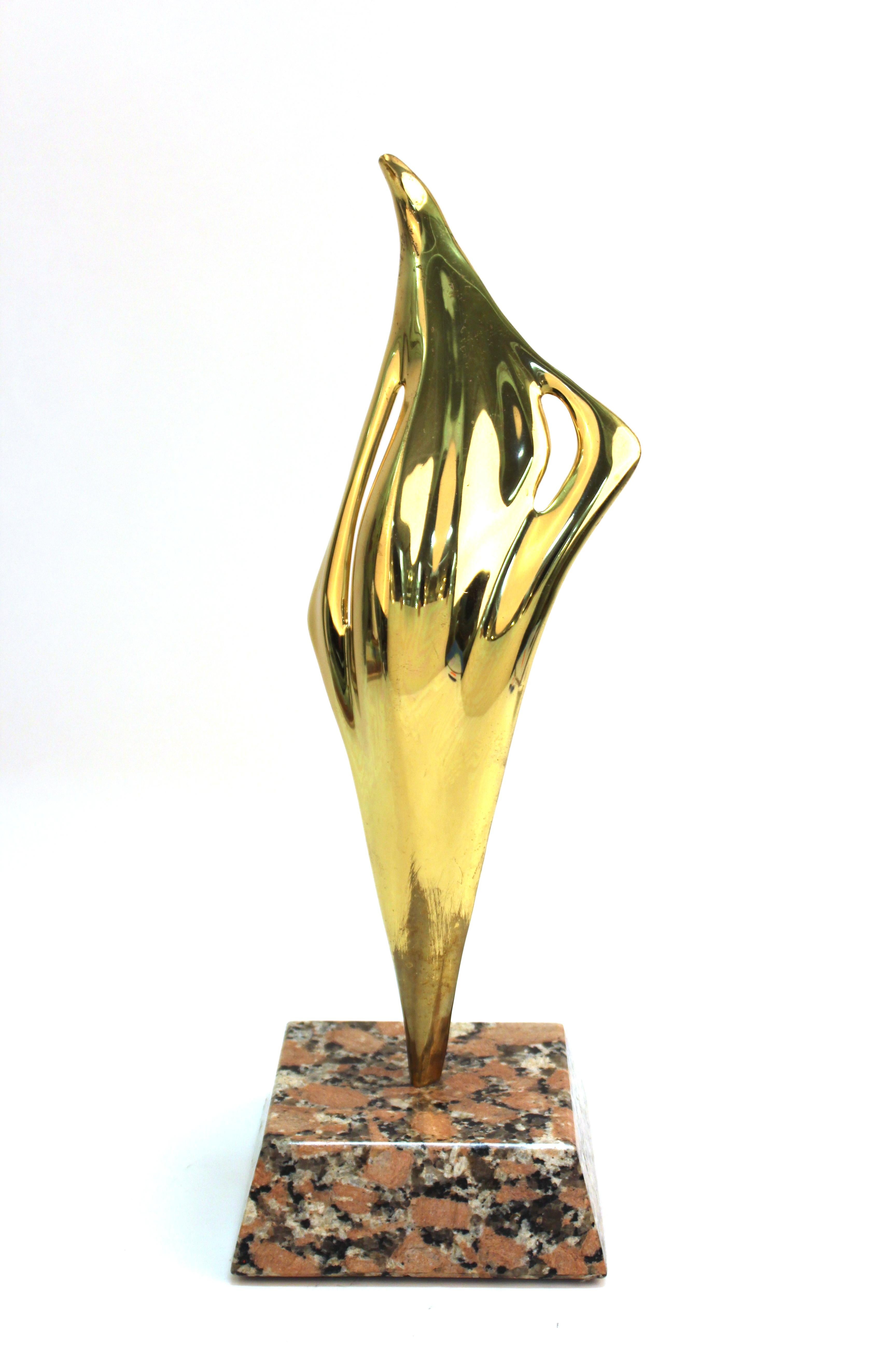 Modern abstract tabletop sculpture made by Ray Tanner. The piece is made of brass and is mounted atop a marble base. Signed by the artist, dated 2002 and numbered #23. In great vintage condition with age-appropriate wear and use.