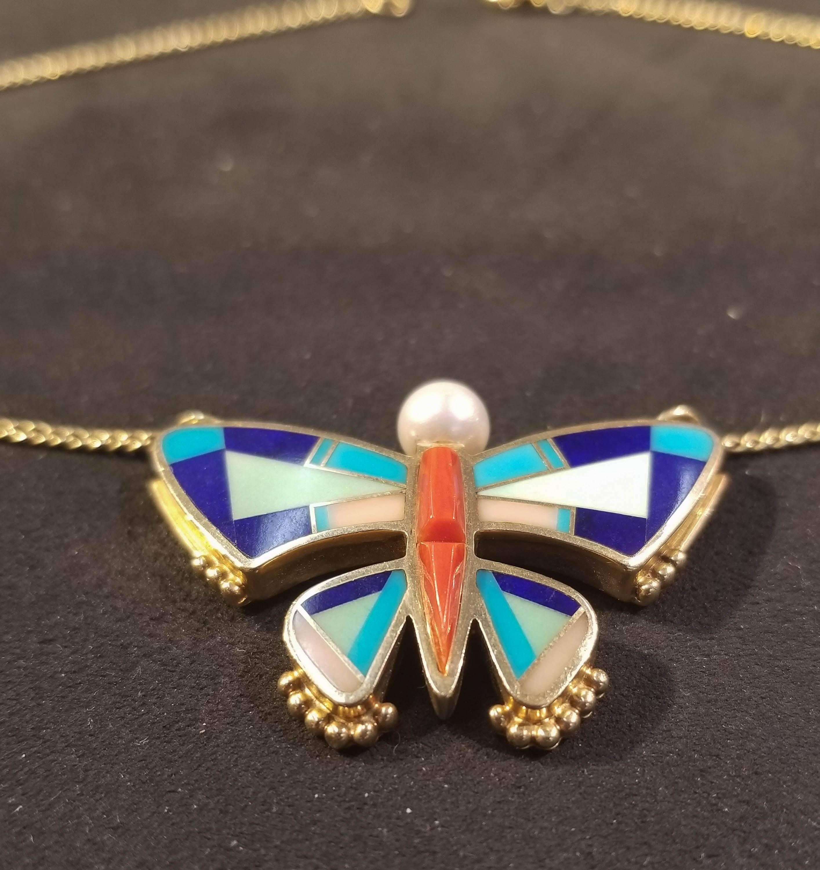 Ray Tracey Multi-Stone Inlay Butterfly Necklace, 14k y/g.
Chain is 14kt yellow gold.
Inlaid stones are Coral, Lapis, Turquoise, Pink Coral and Topped with a Cultured Pearl.