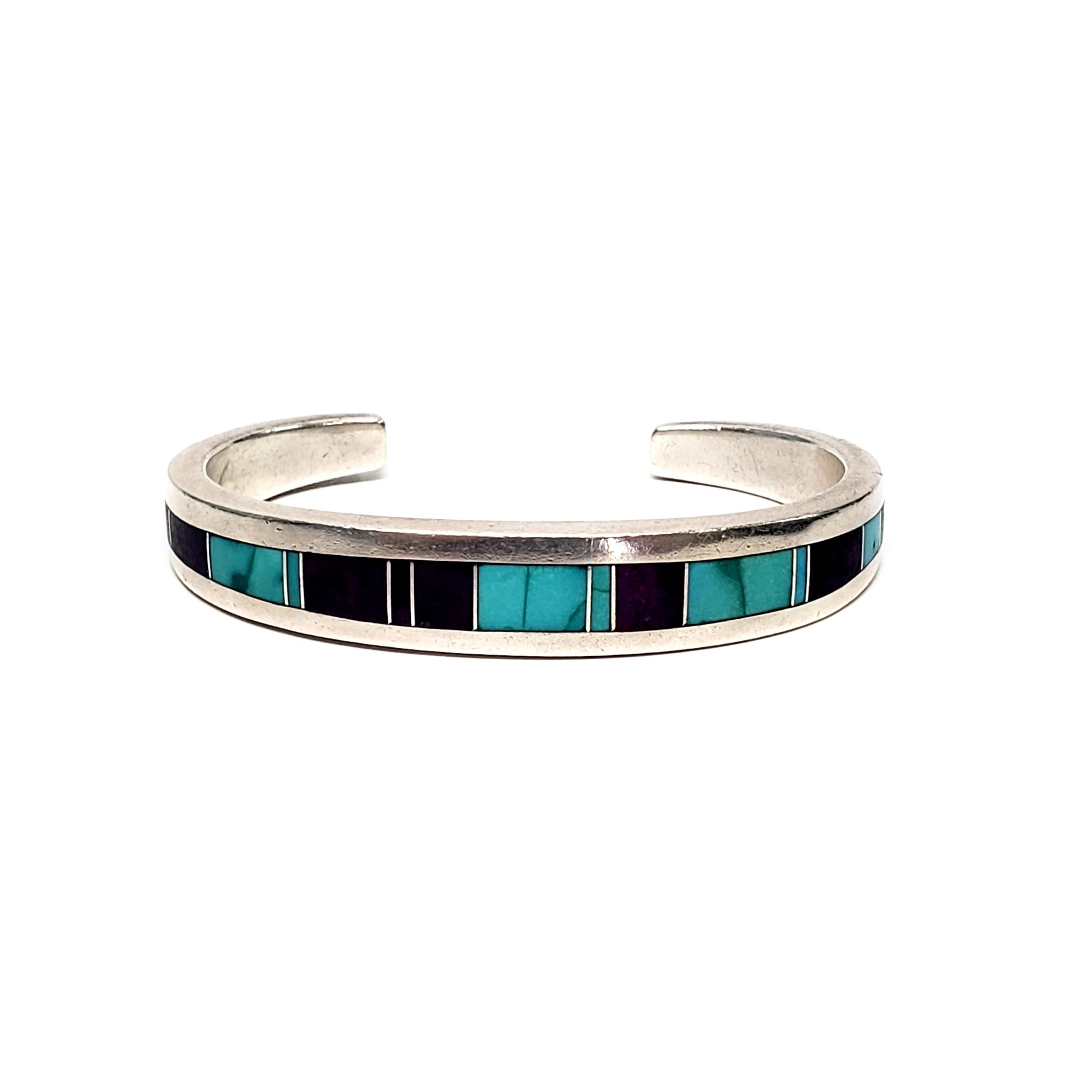 Sterling silver cuff bracelet by Native American Navajo artisan, Ray Tracey.

Beautiful inlaid blue turquoise and purple suglite .

Measures approx 5 1/4