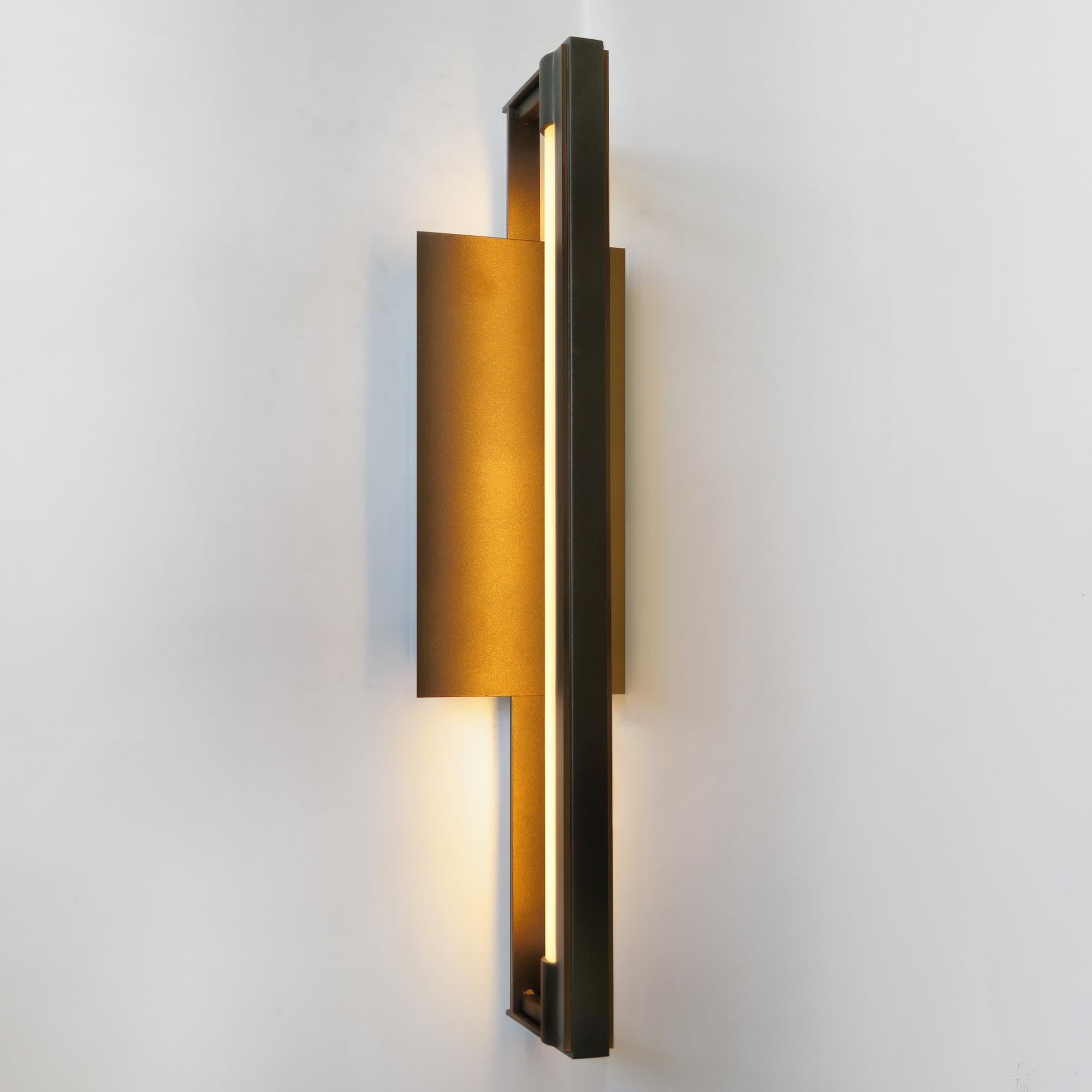 The RAY Wall Sconce is built from cold rolled steel, and is diffused by a minimal frosted, round acrylic rod. The fixture is back-lit with warm white LED strip and makes a beautiful addition to dining rooms, entryways, bathroom vanities, and master