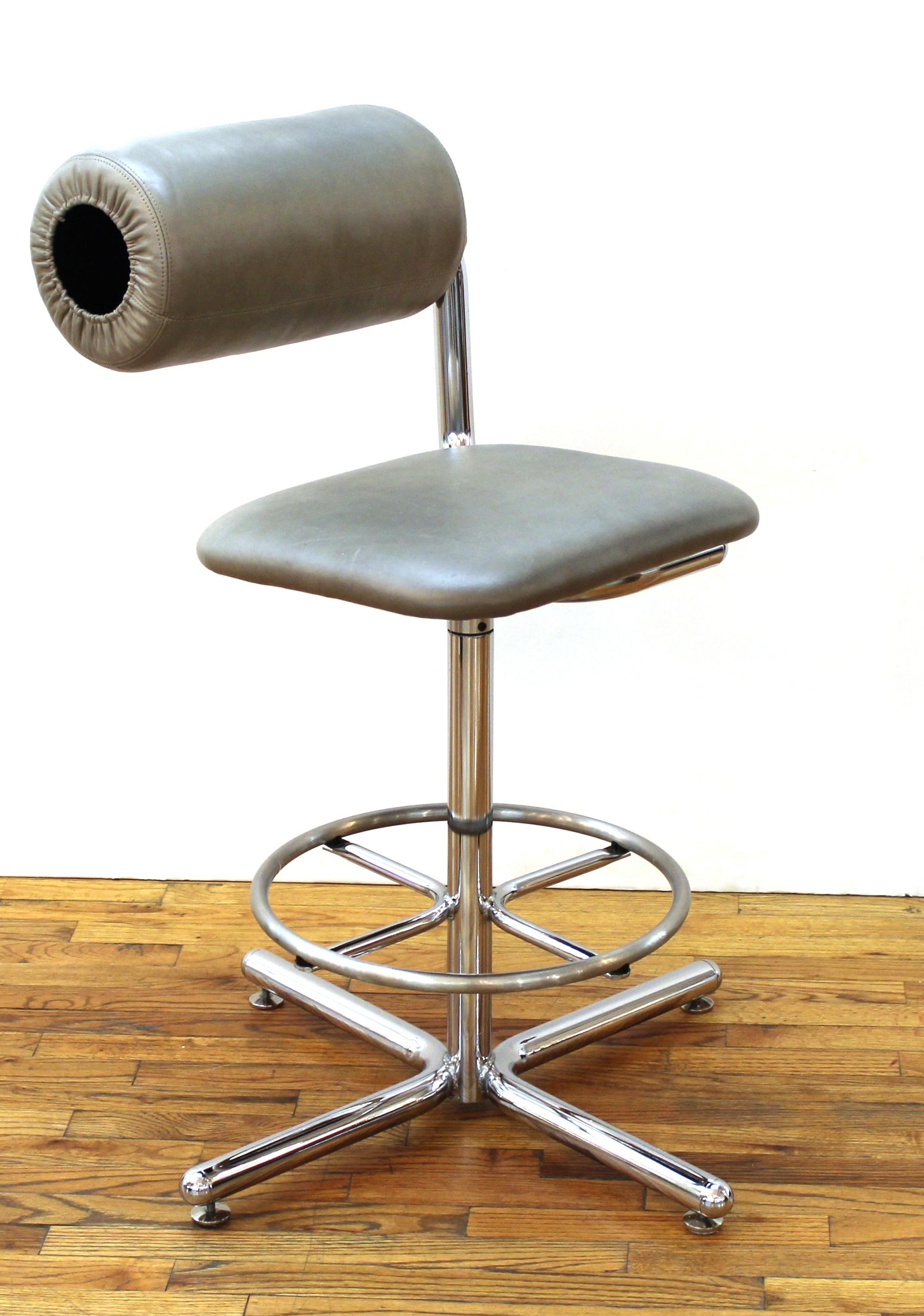 Ray Wilkes for Herman Miller Modern set of four swivel bar stools in chrome with aluminum footrests and with leather upholstery and adjustable back rolls.