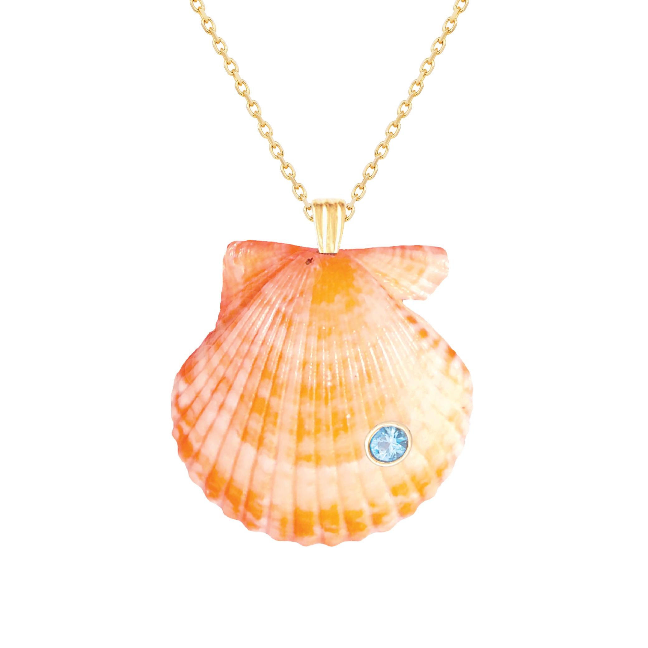 Natural shell pendant with solid 14k gold findings and natural blue topaz gemstone. Wear this pendant alone or layer it with other gold chains for a beautiful layered effect.  

Order includes one shell pendant, exactly as depicted in primary image.