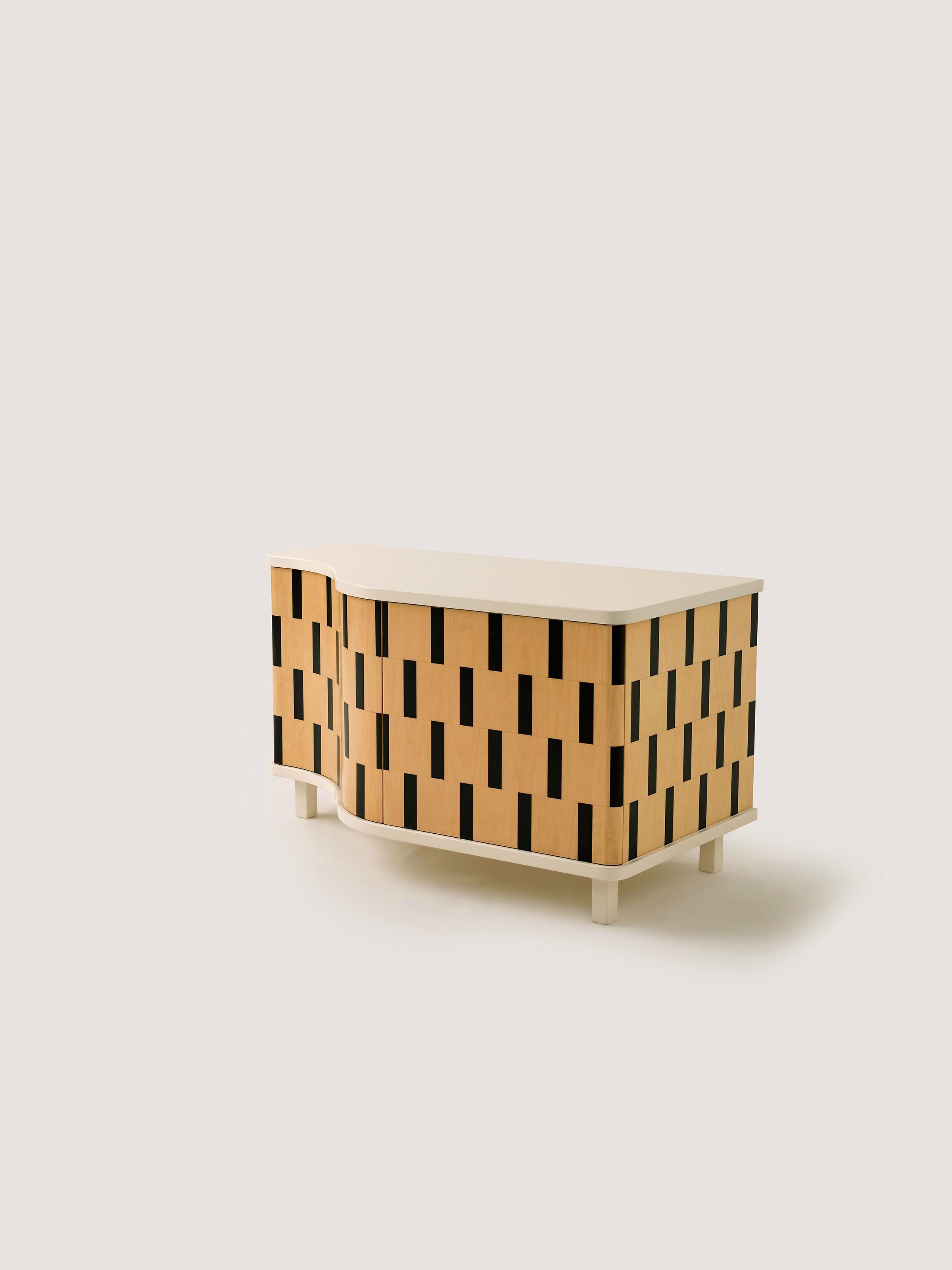 This exclusive credenza is originally designed as a custom shoe cabinet. It is uniquely created by assembling striped geometric wooden veneer pieces together, portraying a 3D illusion.

“Rayas” has been made by using traditional marquetry