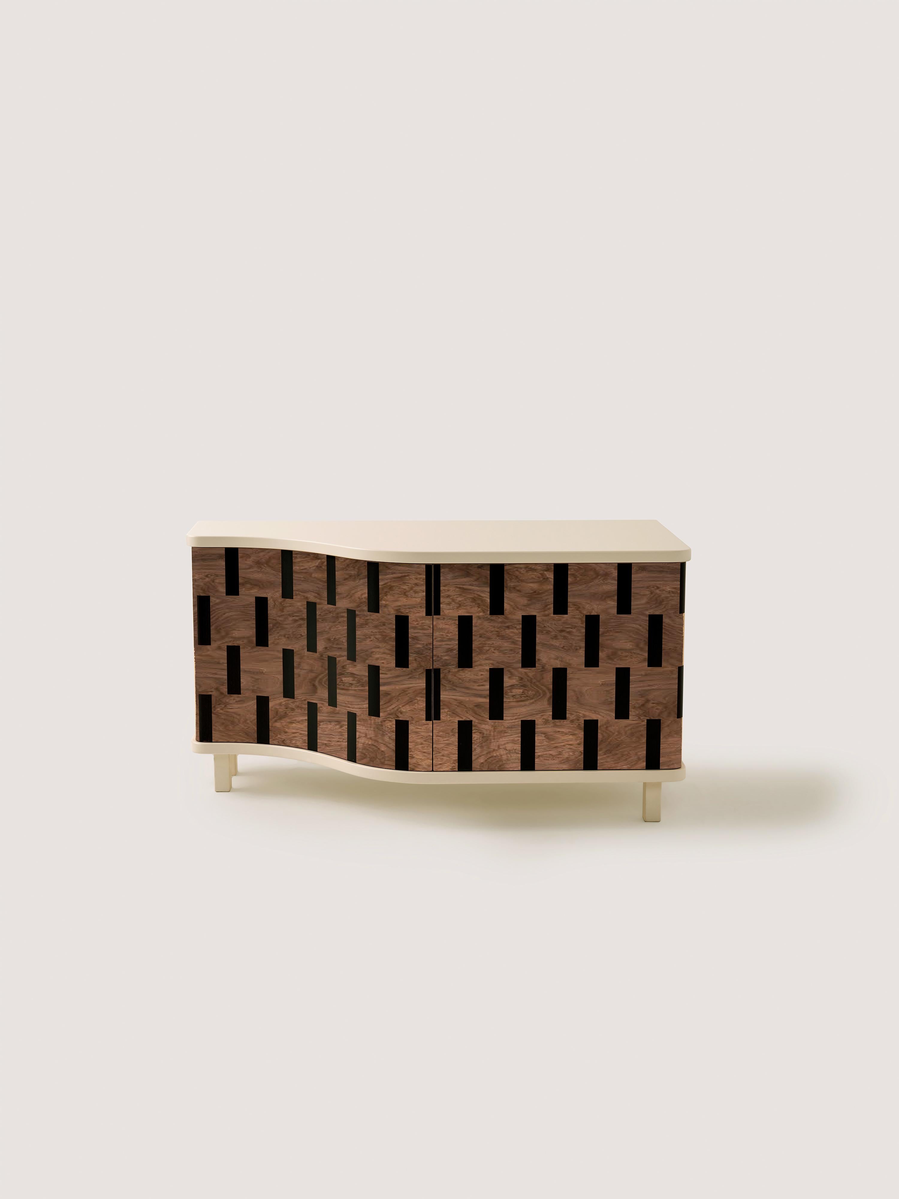 This exclusive credenza is originally designed as a custom shoe cabinet. It is uniquely created by assembling striped geometric wooden veneer pieces together, portraying a 3D illusion.

“Rayas” has been made by using traditional marquetry technique