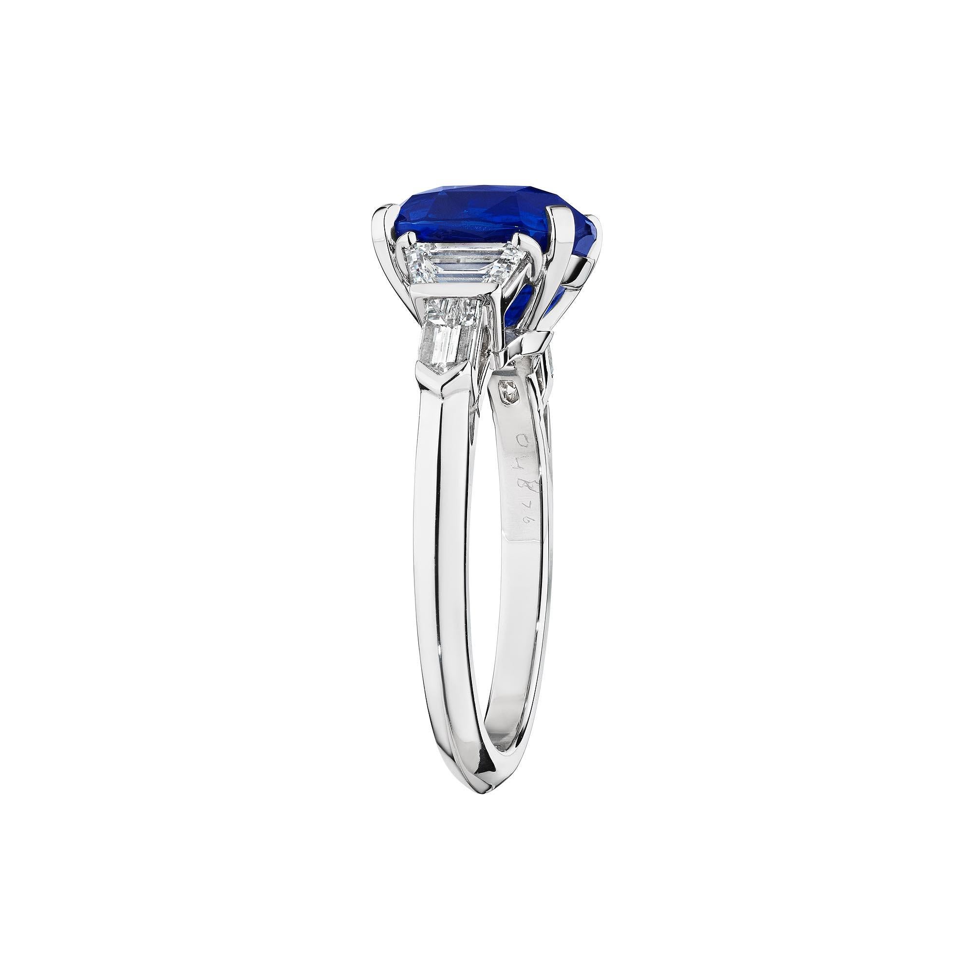 A vibrant velvety blue natural no heat certified 4.01 cushion cut AGL certified sapphire is the eye-catching centerpiece of this extraordinary Raymond C. Yard platinum ring.  With a stunning combination of bullet and trapezoid cut side diamonds,