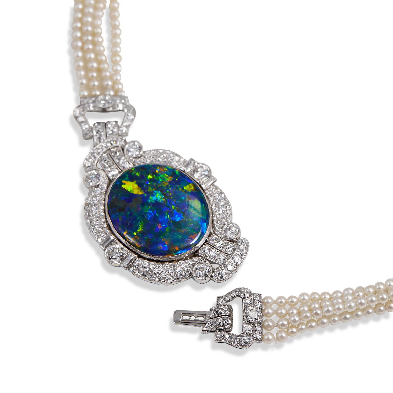 Art Deco black opal, diamond platinum and natural pearl necklace.  This exceptional necklace is a unique bejeweled time capsule  that has been kept out of circulation for decades.  This fine necklace has an estimated 6.0 cts of diamonds in