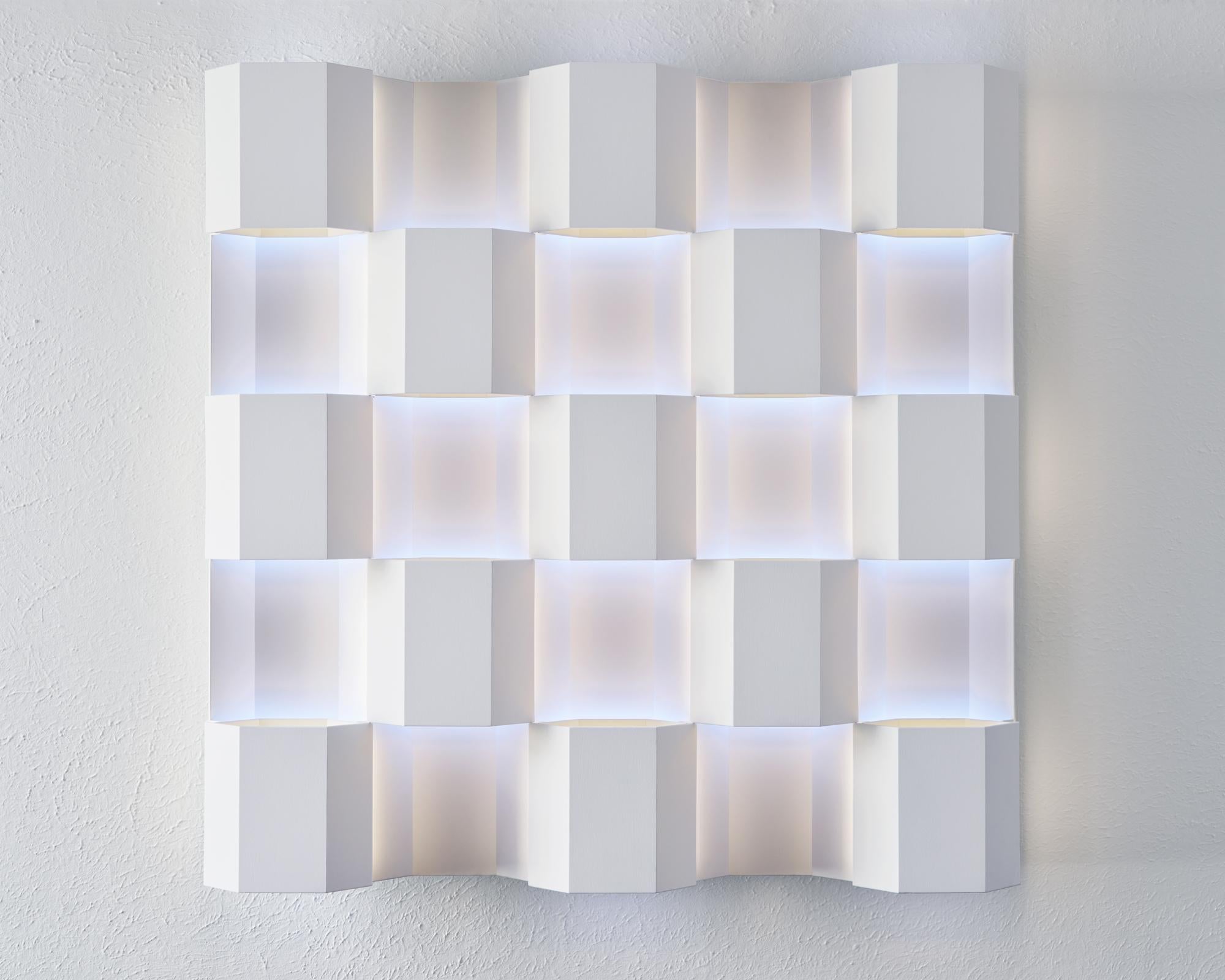 Raymond Graber's celestial light sculptures transform the sense of perception, challenging the human eye’s sense for scale and time with a transcendental perceptual experience. 

In an ethereal interplay between light and space, Graber’s light