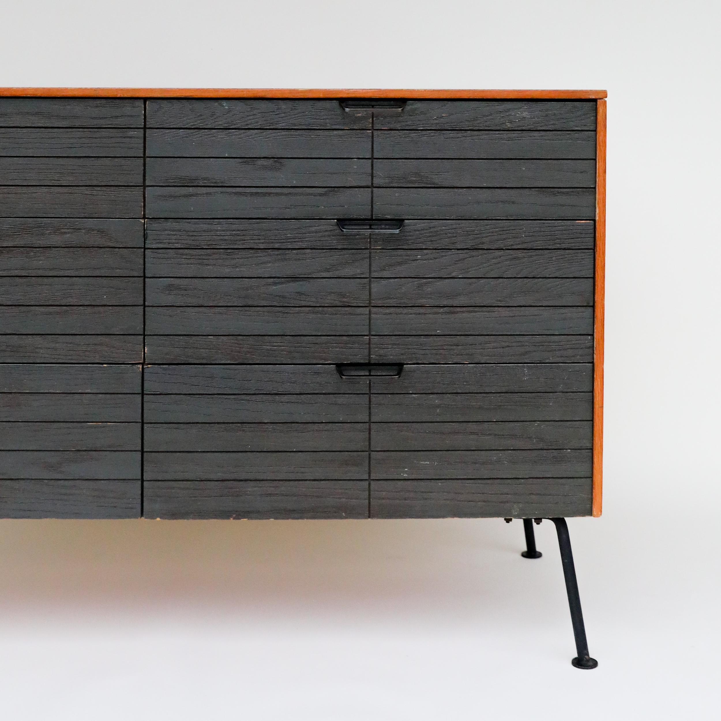 *Price includes Restoration

Uber rare and early Mid-Century Modern dresser by Raymond Loewy for Mengel furniture company. It features enameled oak drawer fronts, modern black steel pulls, and splayed wrought iron legs.

These dressers were