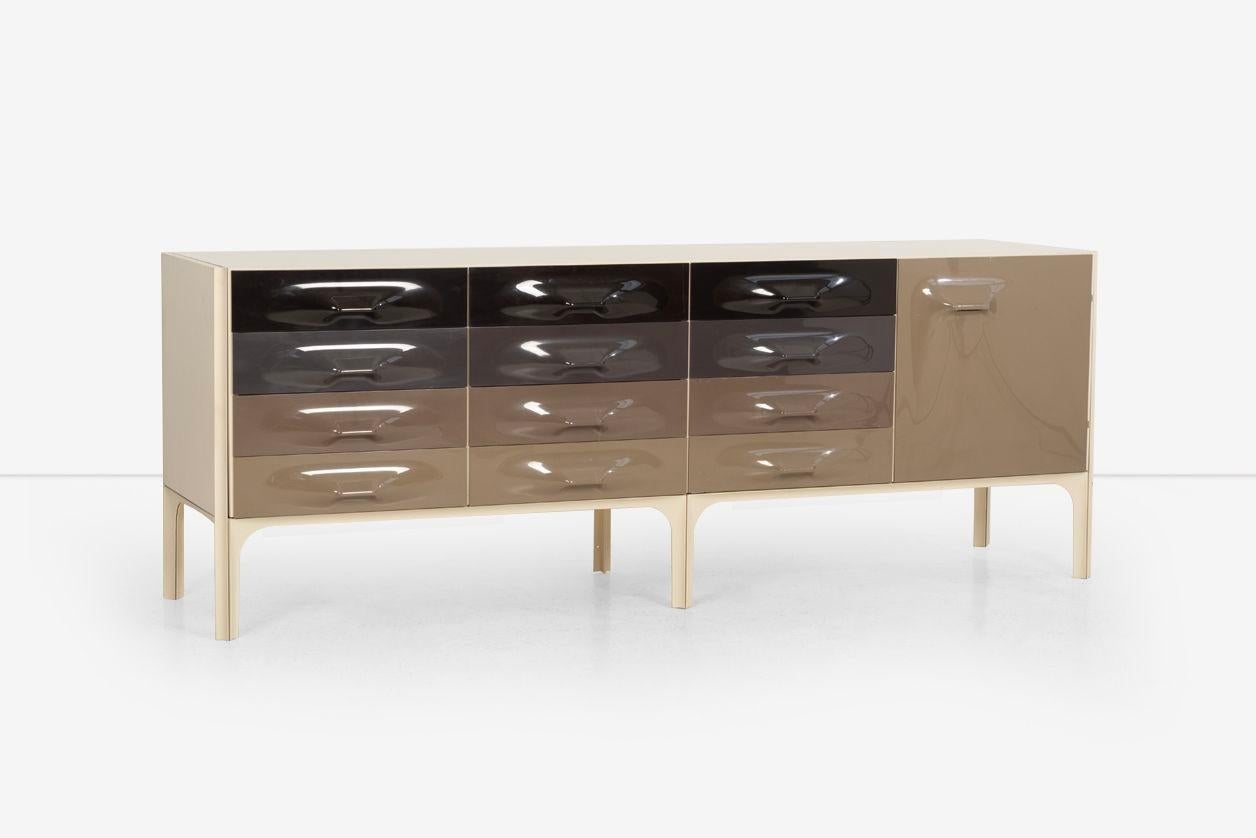 Raymond Loewy DF 2000 Cabinet: Features nine drawers and one door concealing one adjustable shelf. Decal manufacturer's label to interior of one drawer ‘DF 2000’. Materials: laminated wood top, back and sides, enameled aluminum uprights with molded