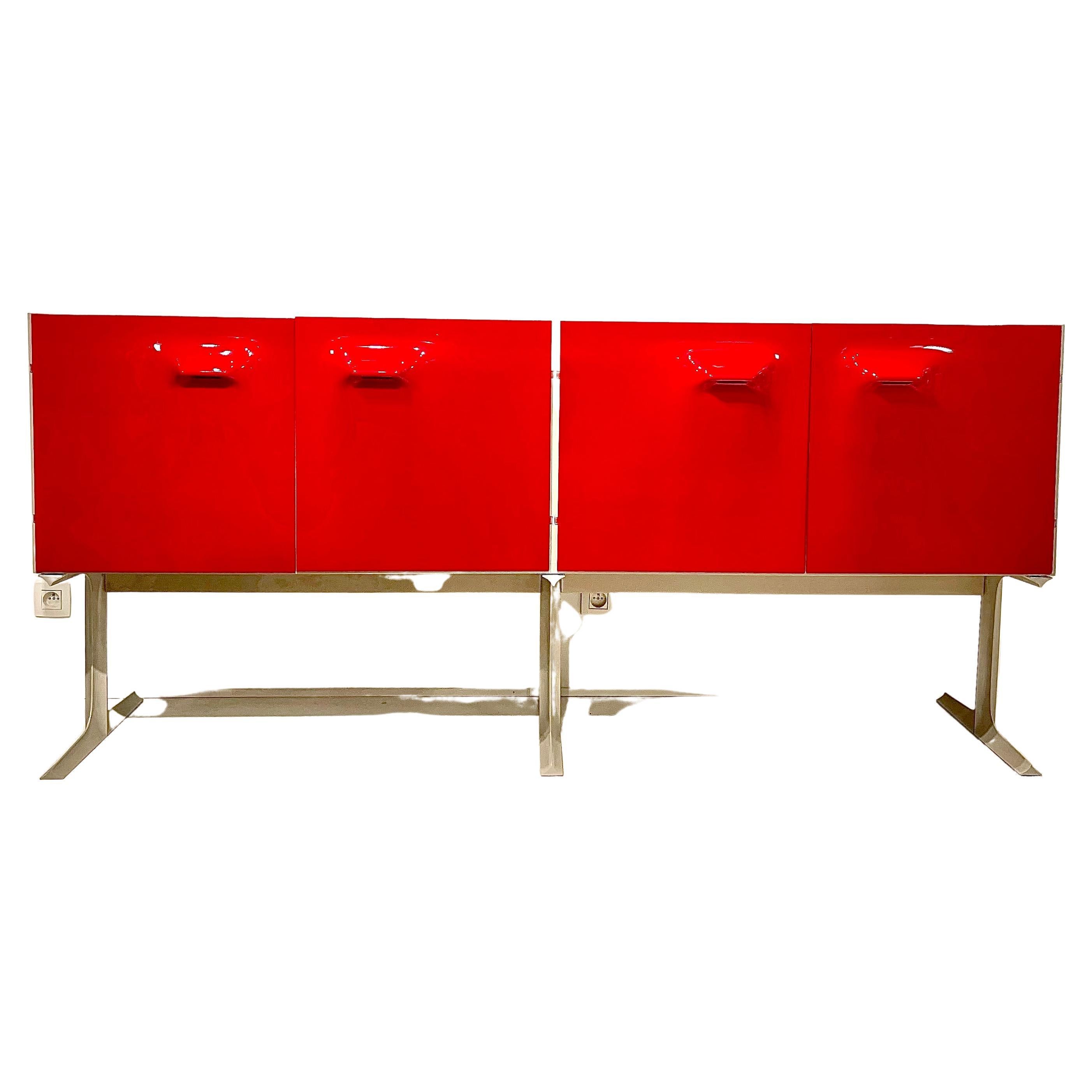 Sideboard designed by Raymond Fernand Loewy. France. C.E.I. - Compagnie d'Esthetique Industrielle, 1968. The DF-2000 sideboard with four drawers and three doors each covered in a moulded plastic facia in red . The piece also incorporates two