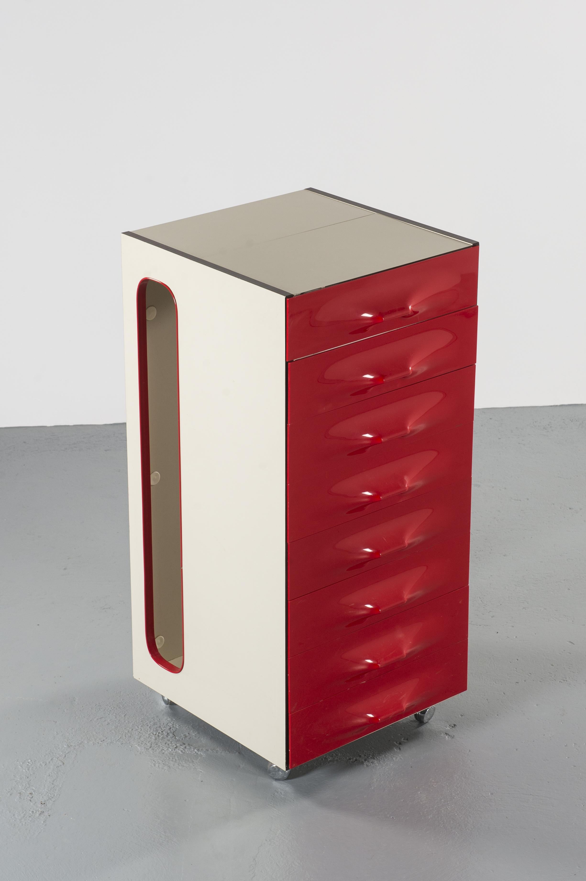 Raymond Loewy Df-2000 valet, circa 1960, France 

The model DF-2000 valet is a compact dressing cabinet designed by Raymond Loewy for Doubinsky Frères, France, 1960s. It is a flip-flap top dressing with mirror. The others are storage drawers