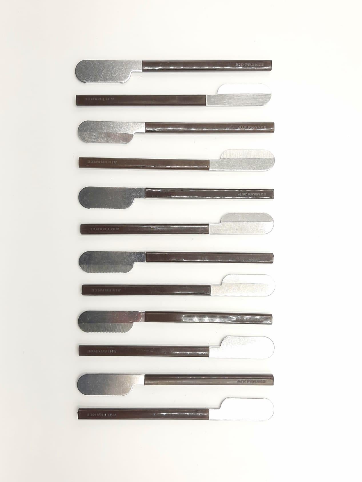 This is original cutlery set of 36 brown pieces : 12 knifes, 12 spoons ,12 forks.
Created by designer Raymond Loewy for Air France. These are made of steel and brown plastic. Each piece is branded 'Air France'. 

Raymond Loewy designed this sleek