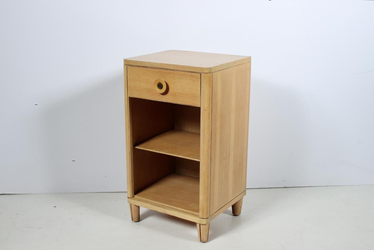 Raymond Loewy for Mengel single drawer Bedside Table with short legs. Featuring a rectangular Bleached Mahogany form with top drawer, wood and brass knob with Mengel M, cubbies, and adjusting, removable shelf. Fantastic storage. Small footprint. 