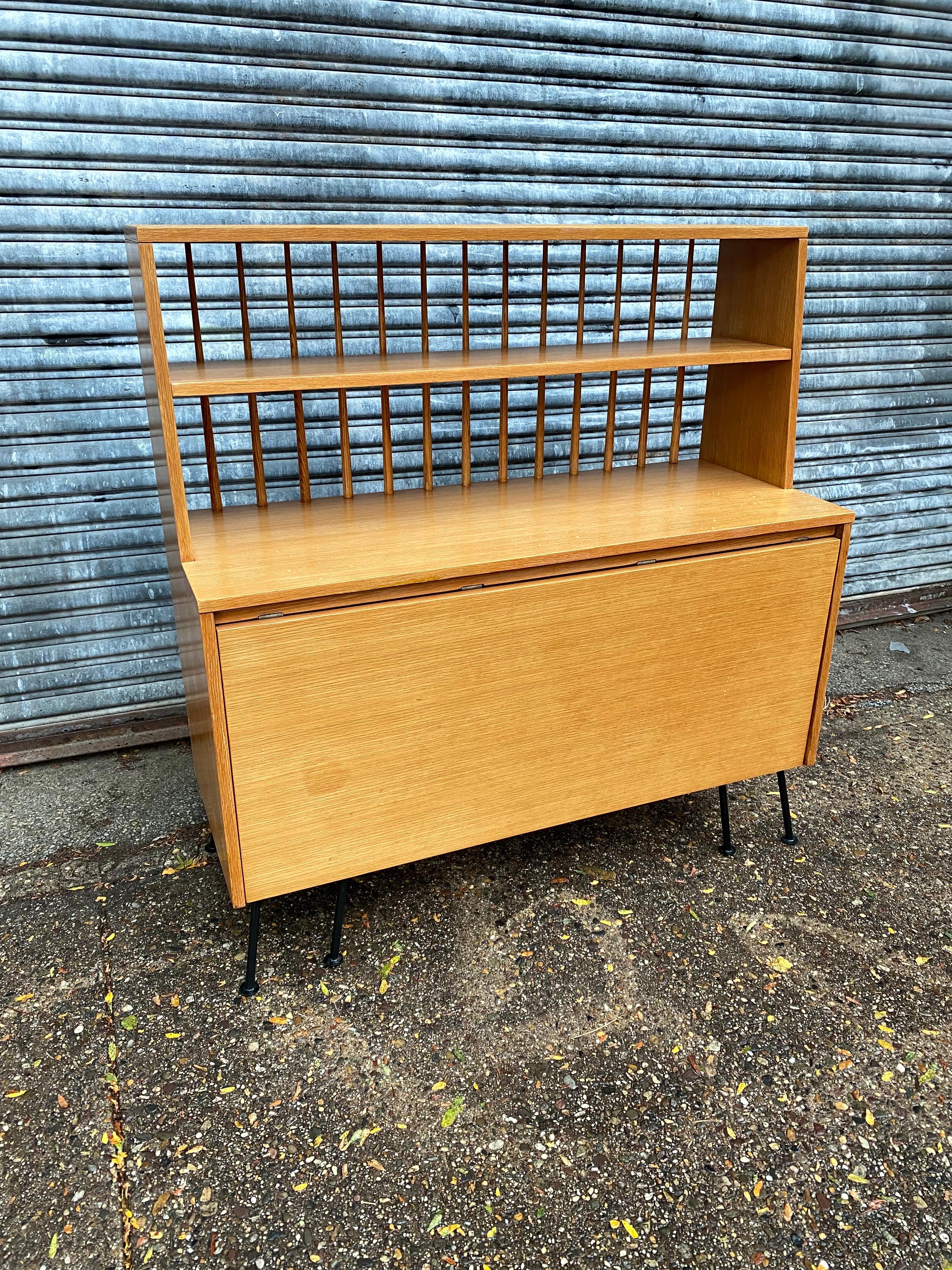 Raymond Loewy versatile buffet/ desk/ dining table! Buffet that does everything! Nice Display area with lower storage. Leaf Pulls up to work as a Desk, but then pulls out more to work as a dining table! Produced by Mengel Furniture in Oak. All