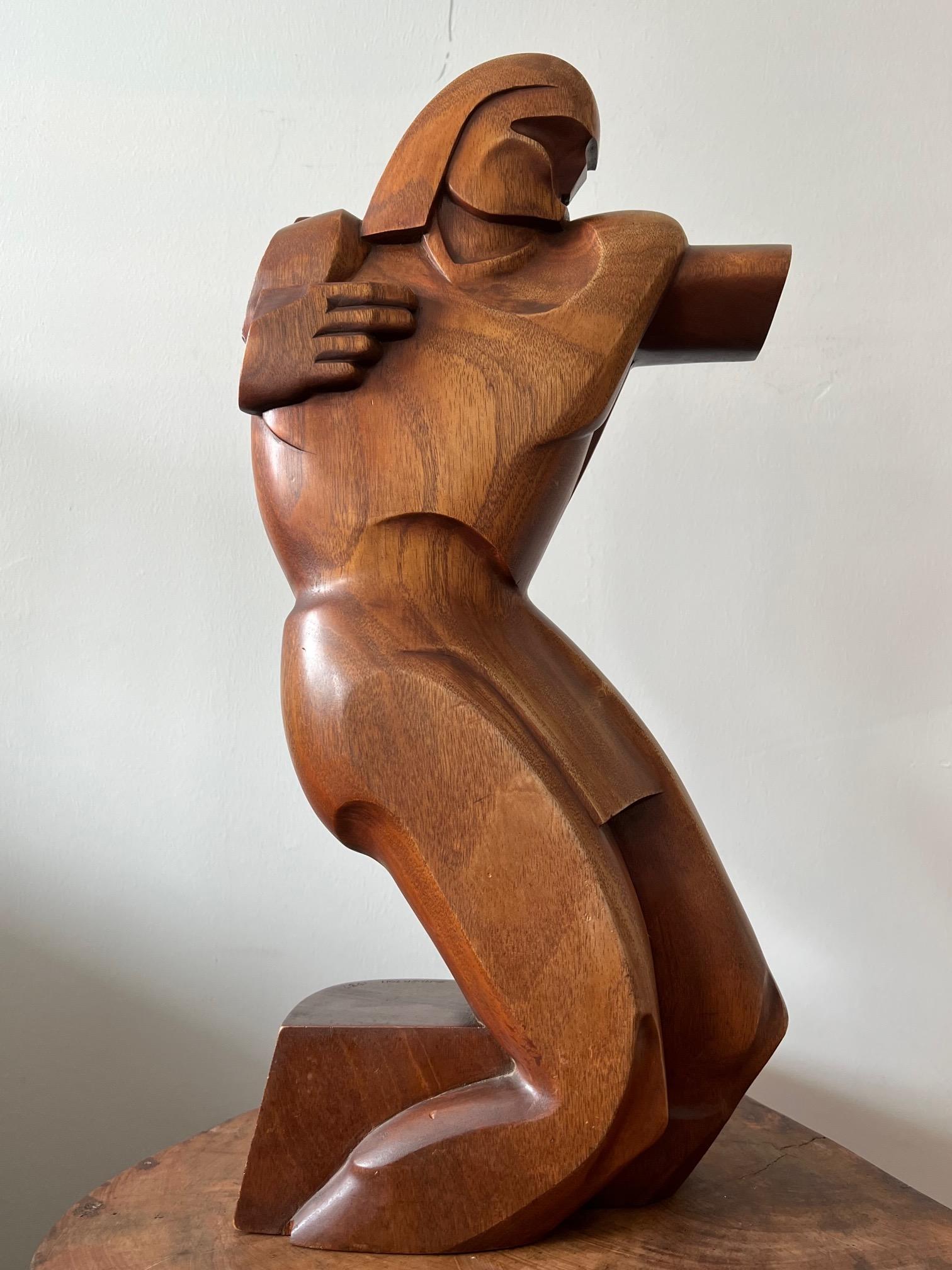 Unusual highly stylized wood carved sculpture by Raymond Phillips Sanderson, signed and dated 1937.  Known for his interest in Southwest themes and influence of Art Deco-this is an excellent example. A note about the artist: 