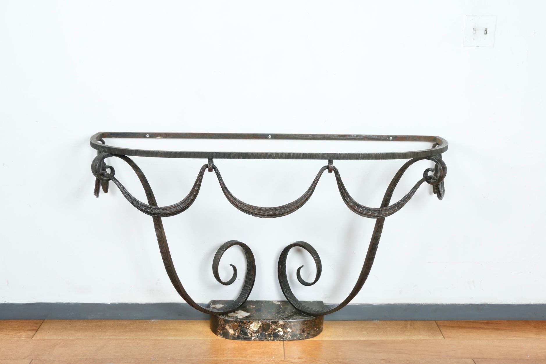 Raymond Subes French Art Deco console table with marble top and bottom base. No damages or cracks on marble and base. Beautifully designed with brass accent detail. Demi lune console has hooks for attachment to the wall.