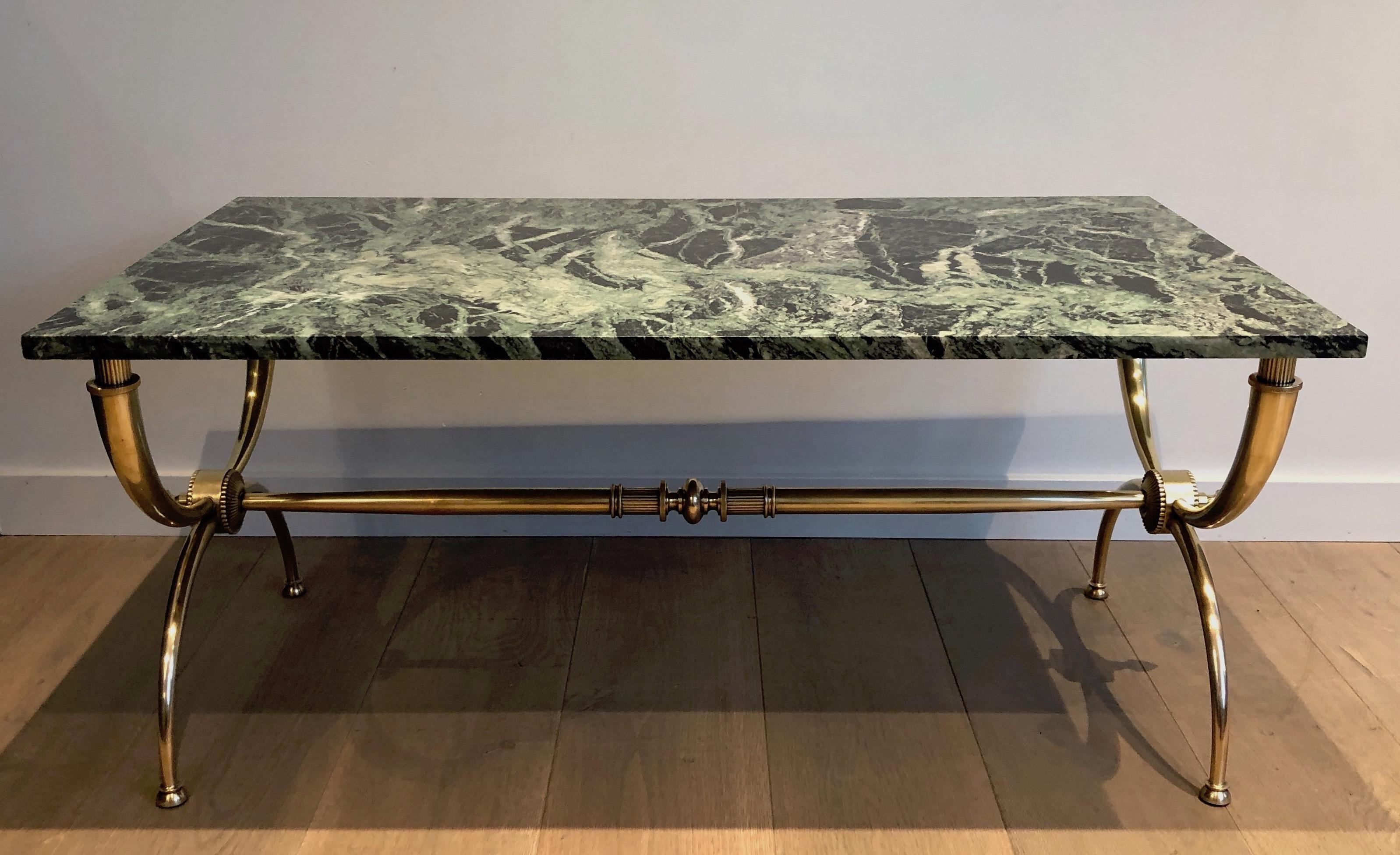 Raymond Subes brass coffee table with green marble top. French work. By Raymond Subes. Circa 1940.