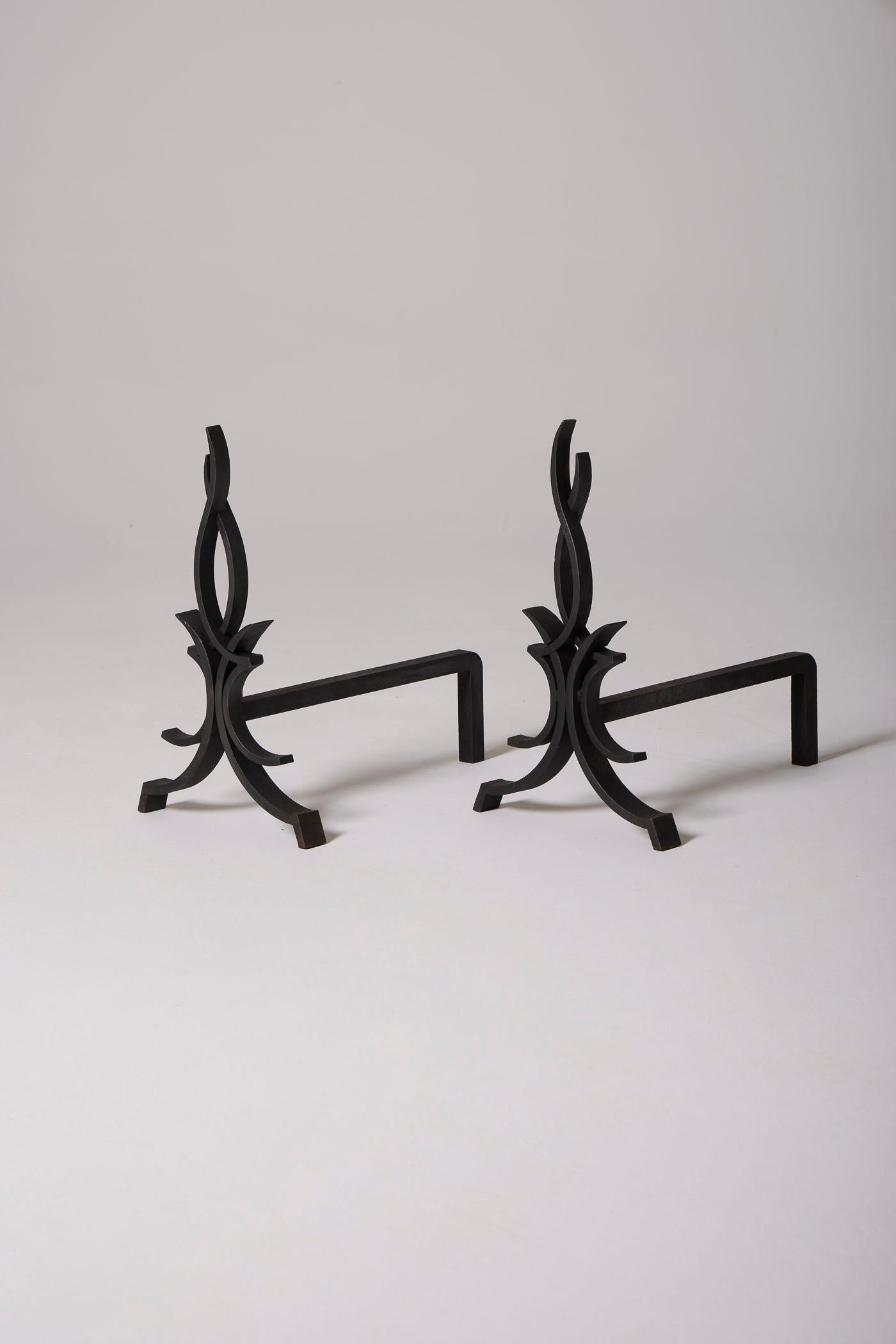 A pair of 'Flames' andirons by designer Raymond Subes. Wrought iron fireplace accessories in perfect condition.
DV498