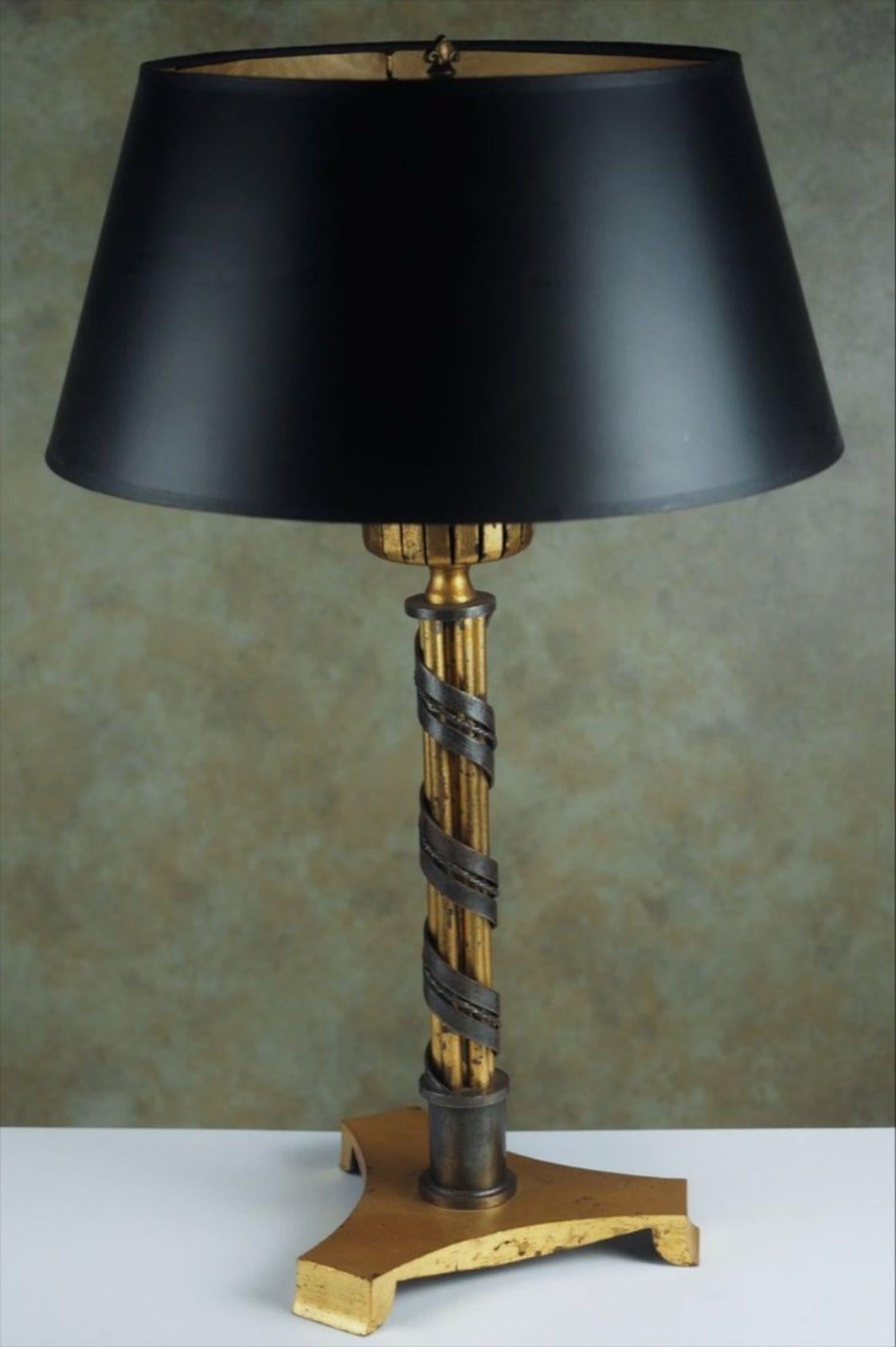 French, 1940s Art Deco table lamp in gilt and patinated forged iron by Raymond Subes, circa 1945. Measures: 23” high overall.