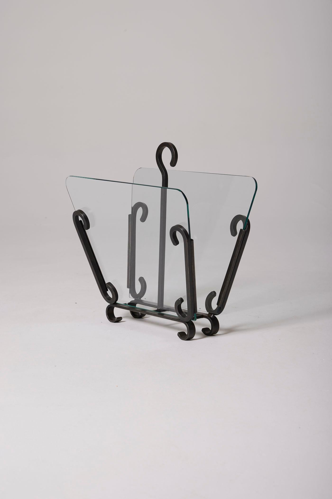 A wrought iron and glass magazine rack by the designer Raymond Subes. In perfect condition.
DV499