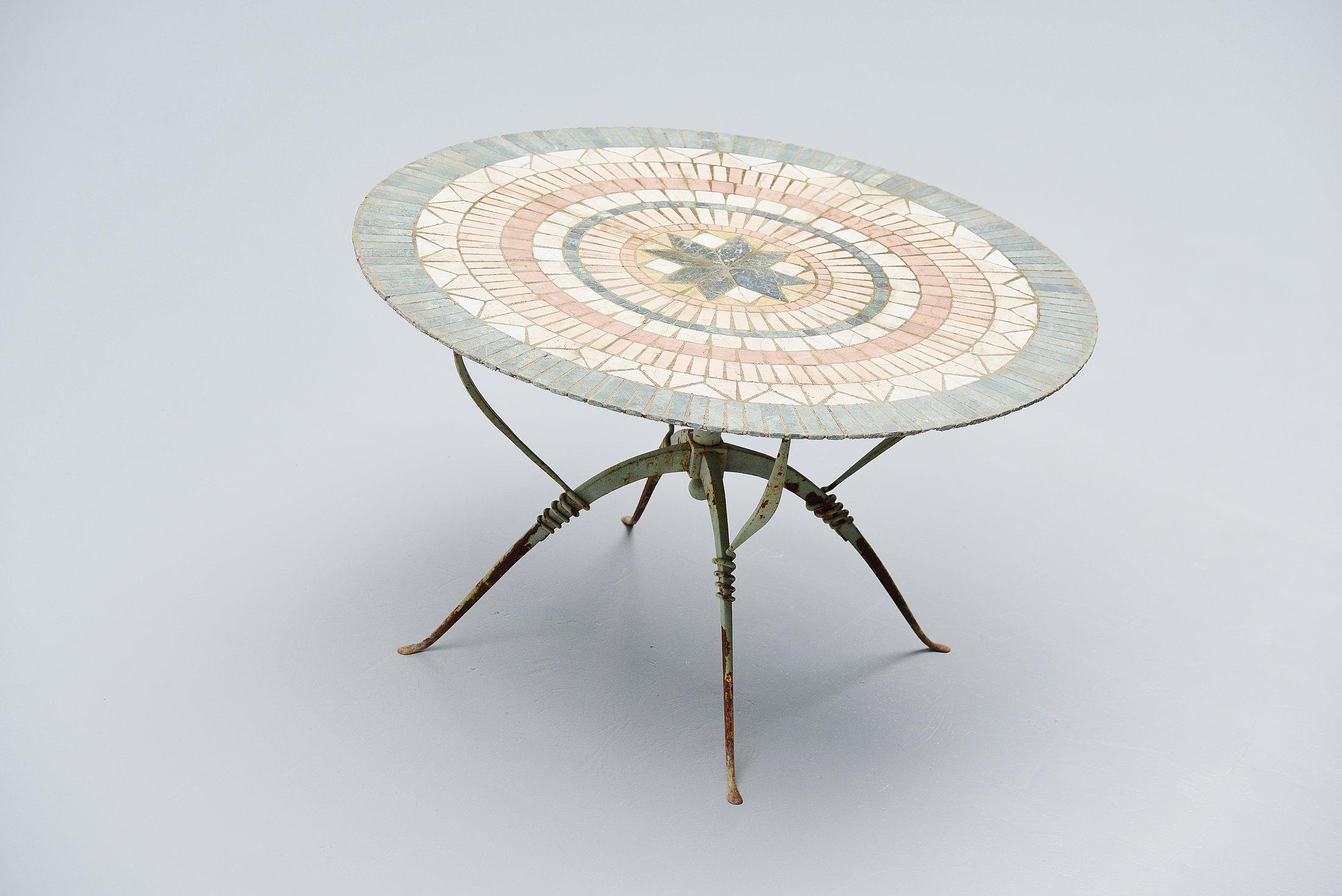 Very nice and exceptional veranda table designed by Raymond Subes for Maison Dominique, France, 1930. This table base is made of mint green painted wrought iron and is fantastic shaped. This is for the first time I see the table with original top,
