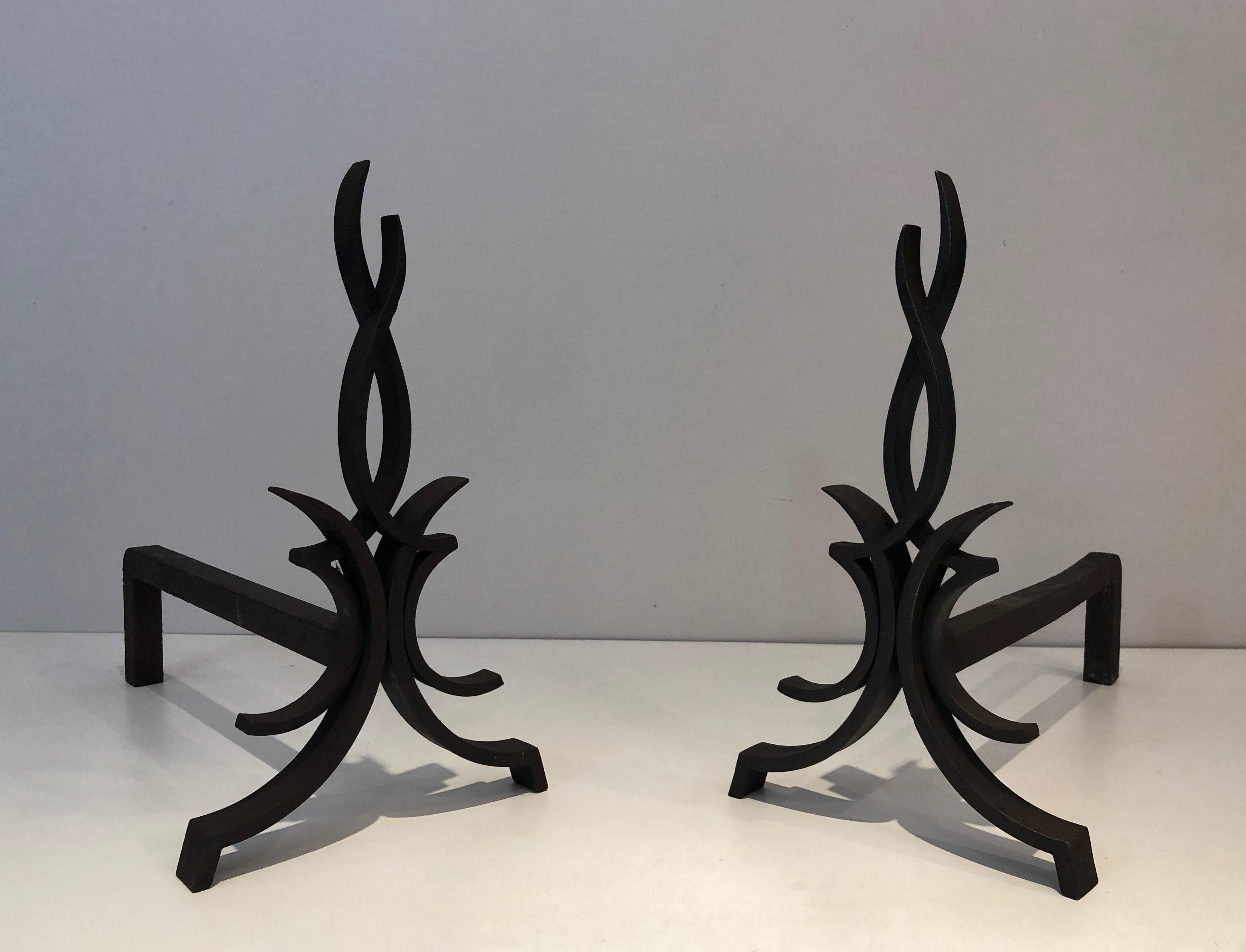 This pair of andirons is made of wrought iron. This is a French work, circa 1940.